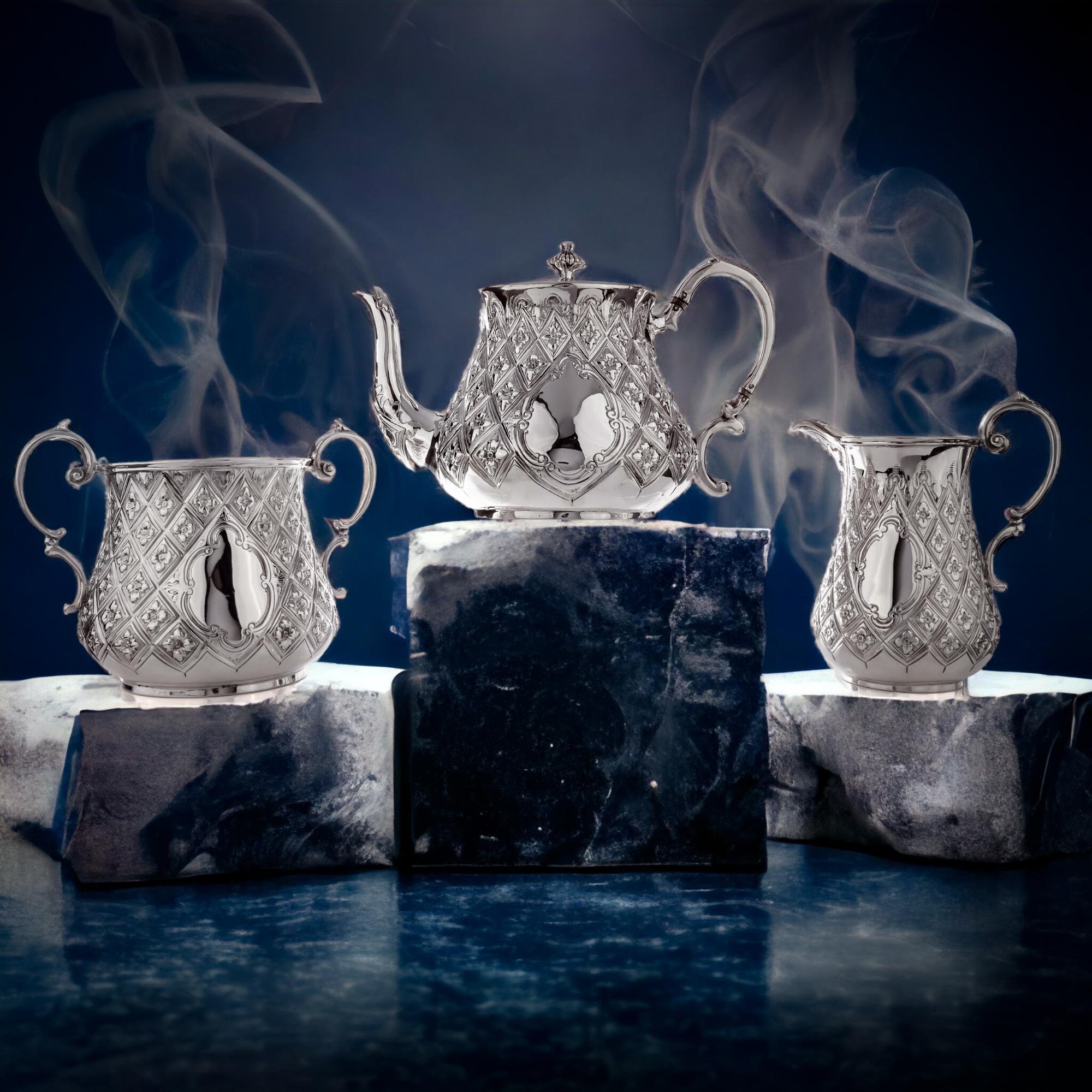 Antique Victorian Silver Three-Piece tea service set.
Made in England, London 1864
Maker: Thomas Smily
Fully hallmarked.

Dimensions -
Teapot: 24.5 x 15.3 x 15.3 cm
Weight: 691 grams

Sugar Bowl: 17.5 x 12.5 x 13 cm
Weight: 382 grams

Cream Jar:
