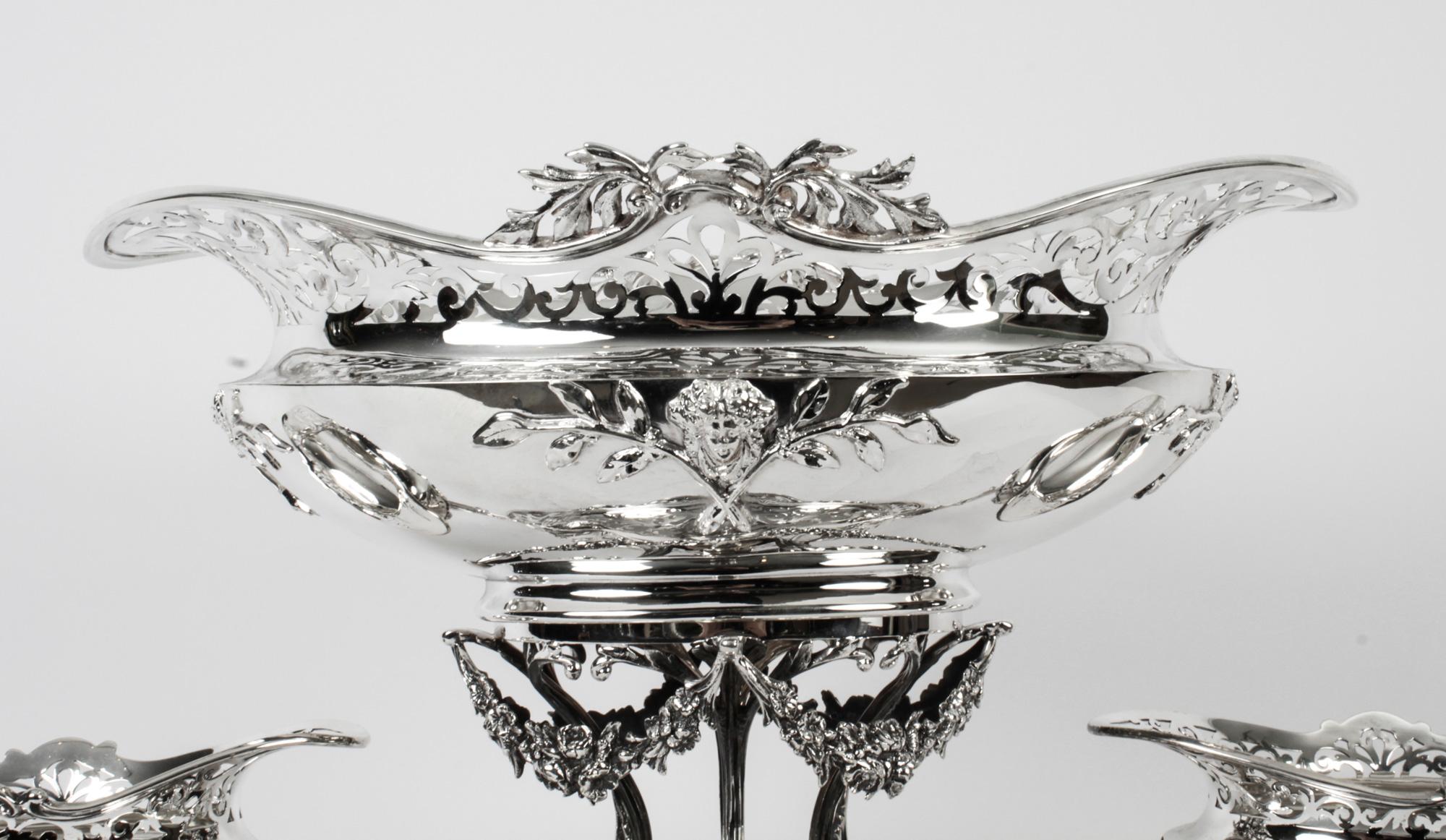 This is a large and impressive antique silver-plated Victorian centrepiece bearing the makers mark of the renowned silversmiths to the Queen, Mappin & Webb of London, dated 1880.
 
This wonderful centerpiece was made with a large central basket