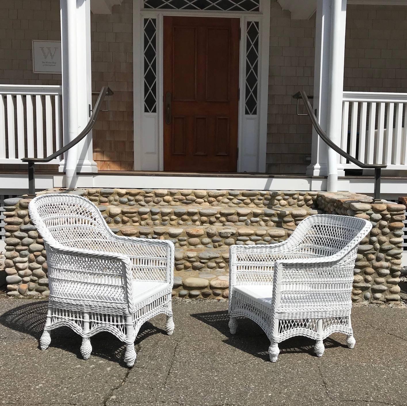 Beautiful and rare antique wicker chairs with six legs and pressed cane seats. These chairs were intricately woven by hand at the turn of the century. These chairs have been freshly painted white. They are very similar but not identical. Chair #1