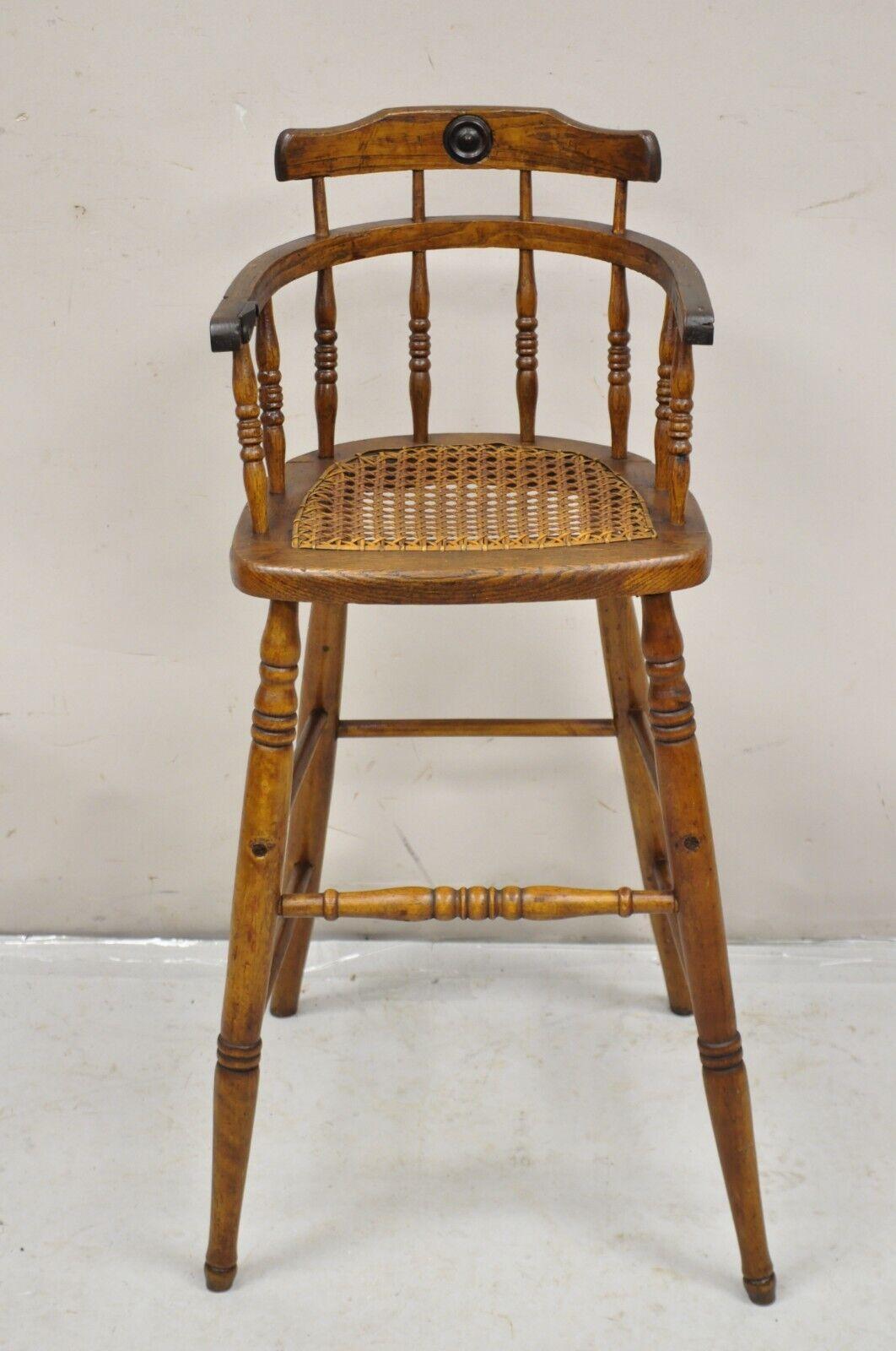 Antique Victorian Small Child's Oak Wood Spindle Cane Seat High Chair. Circa 19th Century. Measurements: 33