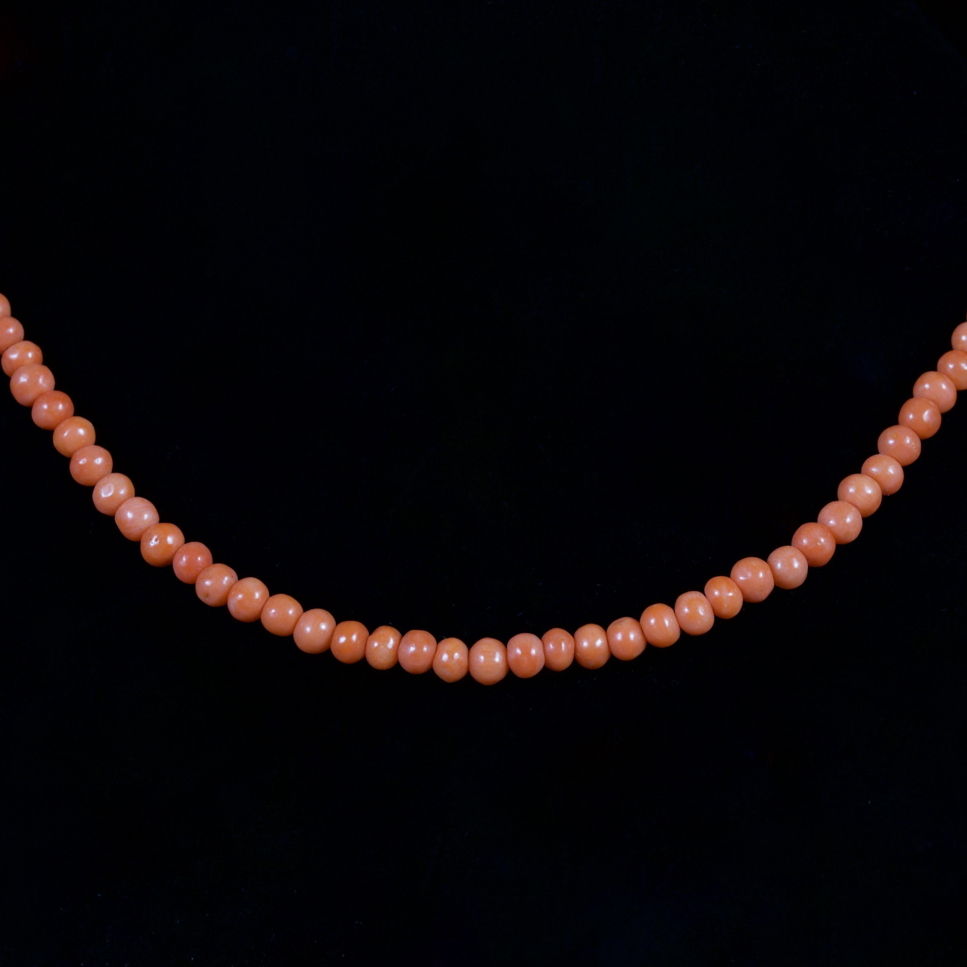 This Victorian Coral Necklace is wonderful, Circa 1900.

The necklace is adorned in beautiful Corals that show a rich orange hue from within.

The necklace is of a small size and would be suitable from a baby or young child.

From the depths of the