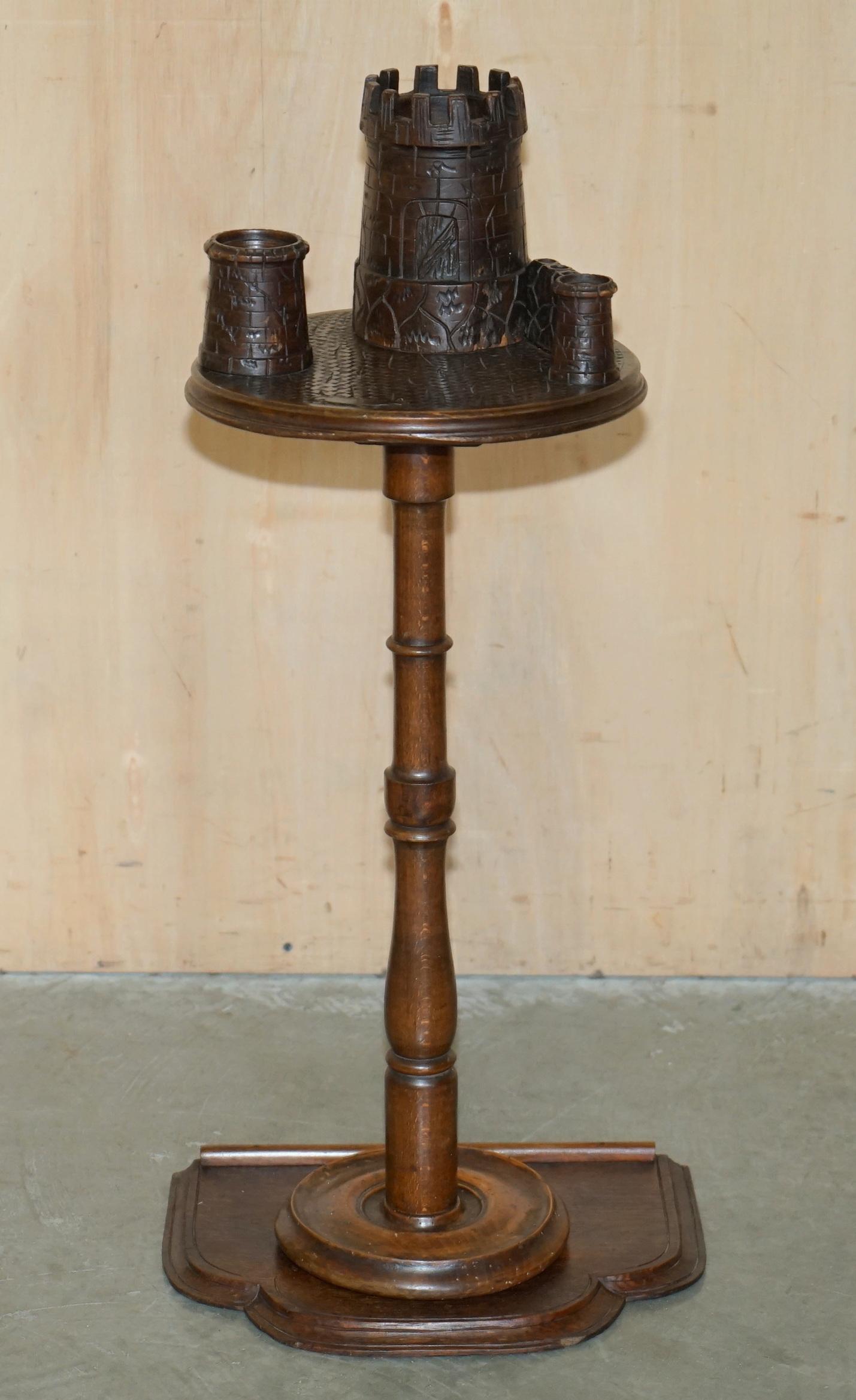 Royal House Antiques

Royal House Antiques is delighted to offer for sale this exquisitely crafted, Antique late Victorian Smokers side table depicting castle turrets for Cigars, Pipes & Tobacco 

Please note the delivery fee listed is just a guide,