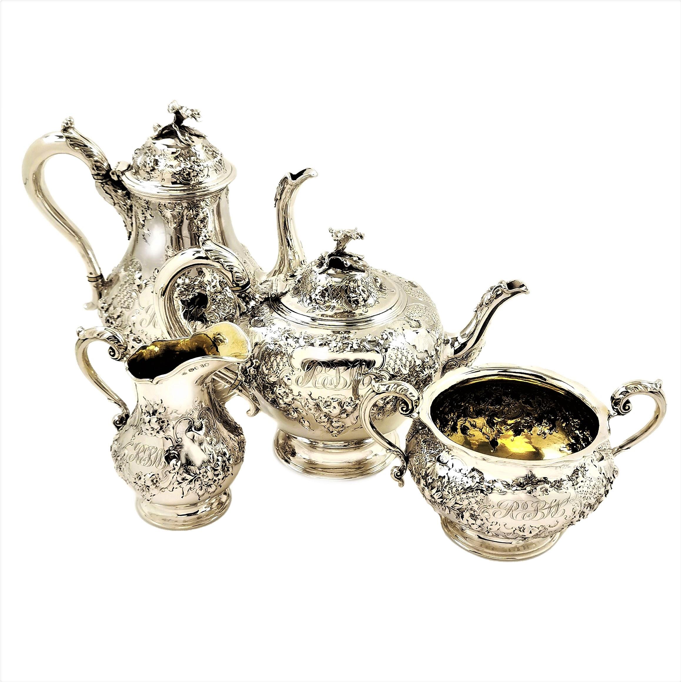 A beautiful Antique Victorian sterling Silver Tea and Coffee Set consisting of a Teapot, a Coffee Pot, a Cream / Milk Jug and a Sugar Bowl. The entire Set is decorated with a gorgeous ornate chased design showing a rich assortment of flowers. Each