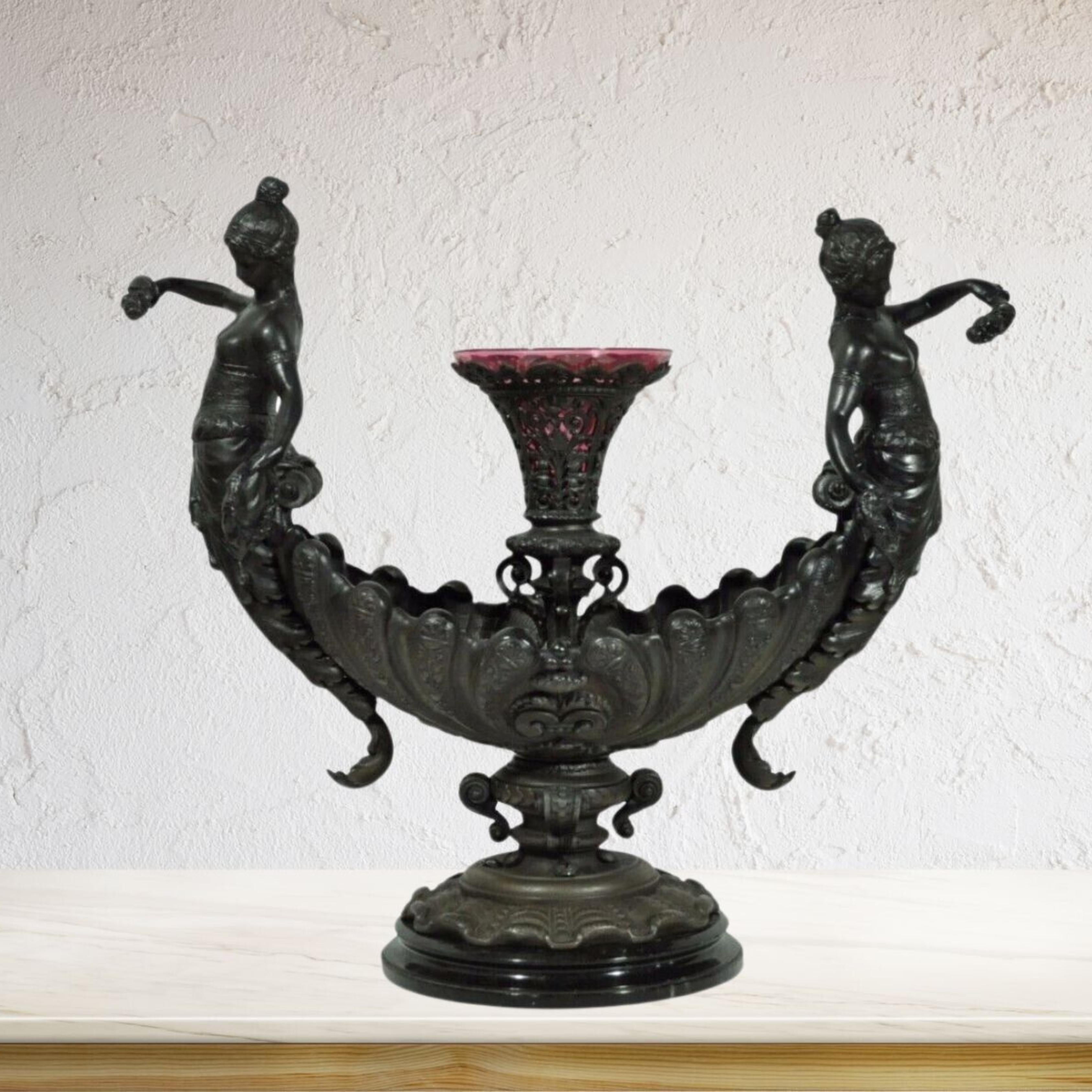 Antique Victorian Spelter & Marble Figural Mermaid Centerpiece Bowl Vase Epergne. Item features ornate detailed mermaids figures, black marble plinth, pinkish purple vase insert, substantial overall weight (approx 32 lbs.). Circa 1900. Measurements: