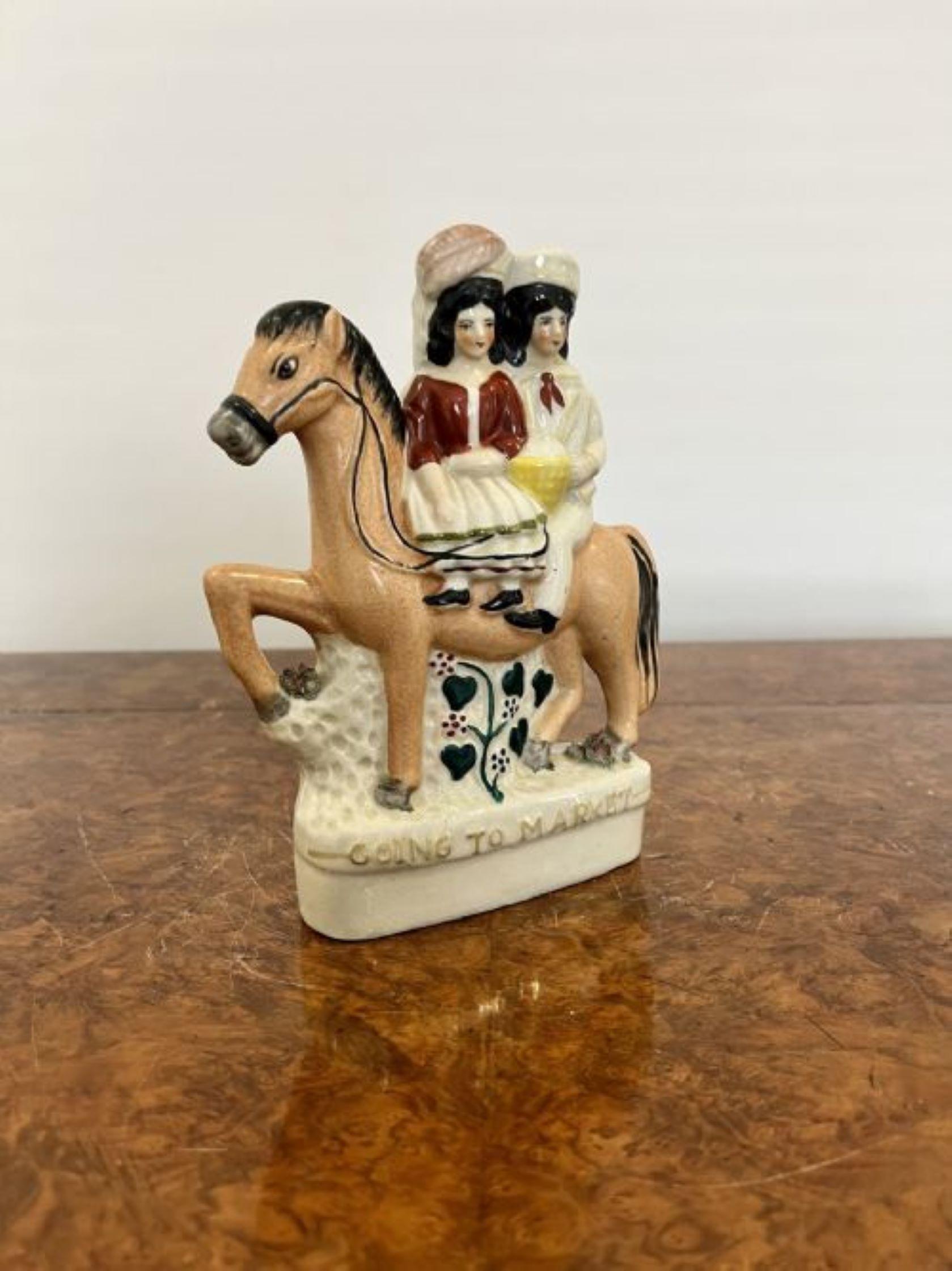 Antique Victorian Staffordshire 'going to market' figure of two people riding on a horse in wonderful period clothing in lovely green, yellow, brown and cream colours 