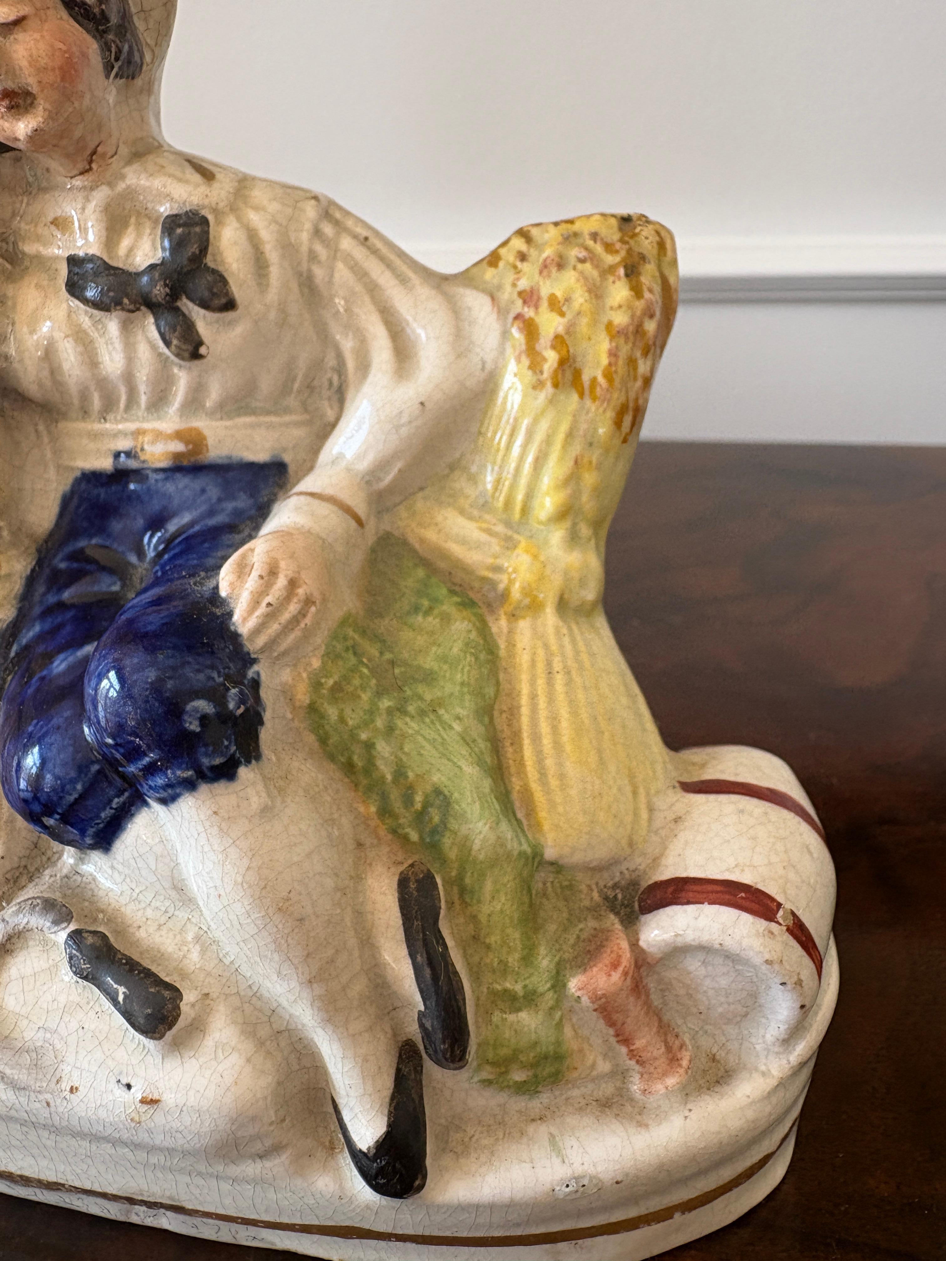 Antigua figura victoriana de espalda plana de Staffordshire de un segador durmiendo entre el heno bajo una jarra derramadora.

En perfecto estado, sin astillas, grietas ni reparaciones

Dimensiones:
Altura 15 cm (5,90 pulg.)
Anchura 13 cm (5,12