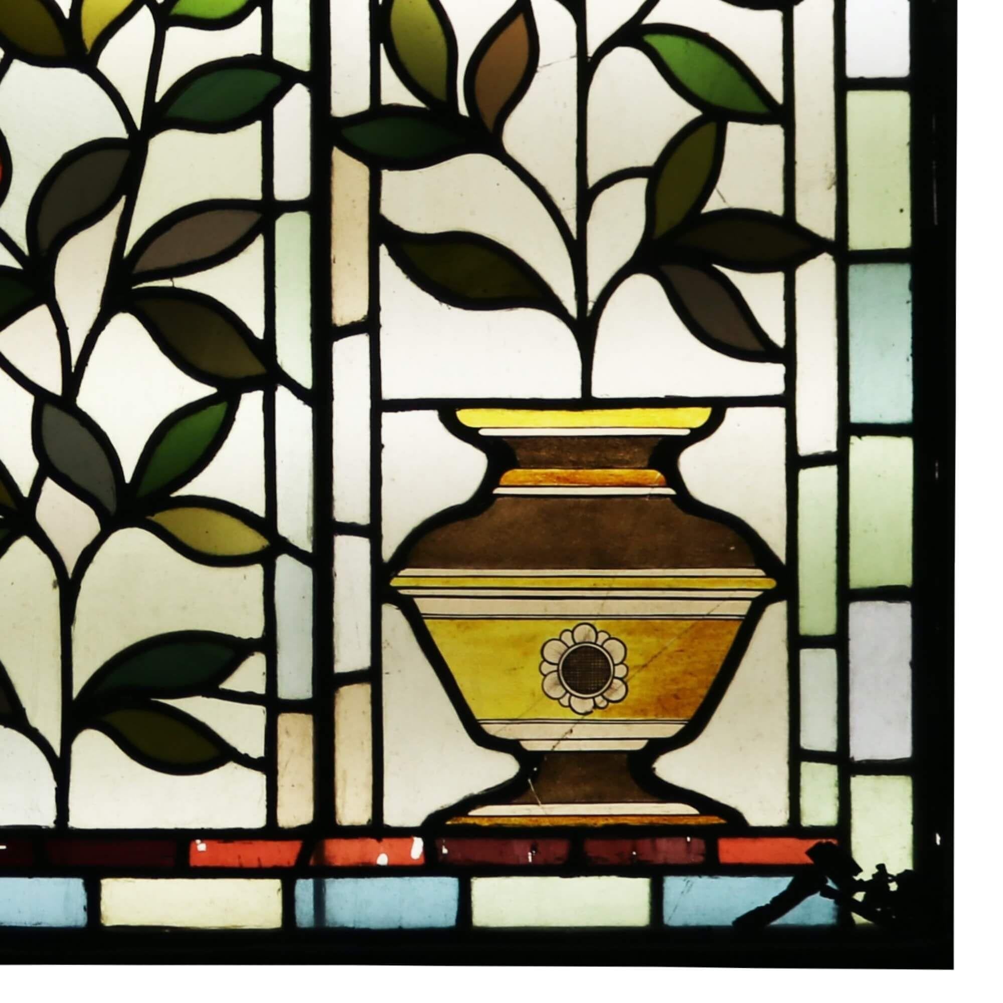 A large antique Victorian stained glass window over 1m tall depicting orange and lemon plants in pots, circa 1890. You can just imagine this gorgeous stained glass as a feature window in a Victorian property, the vibrant yellows, red, oranges and