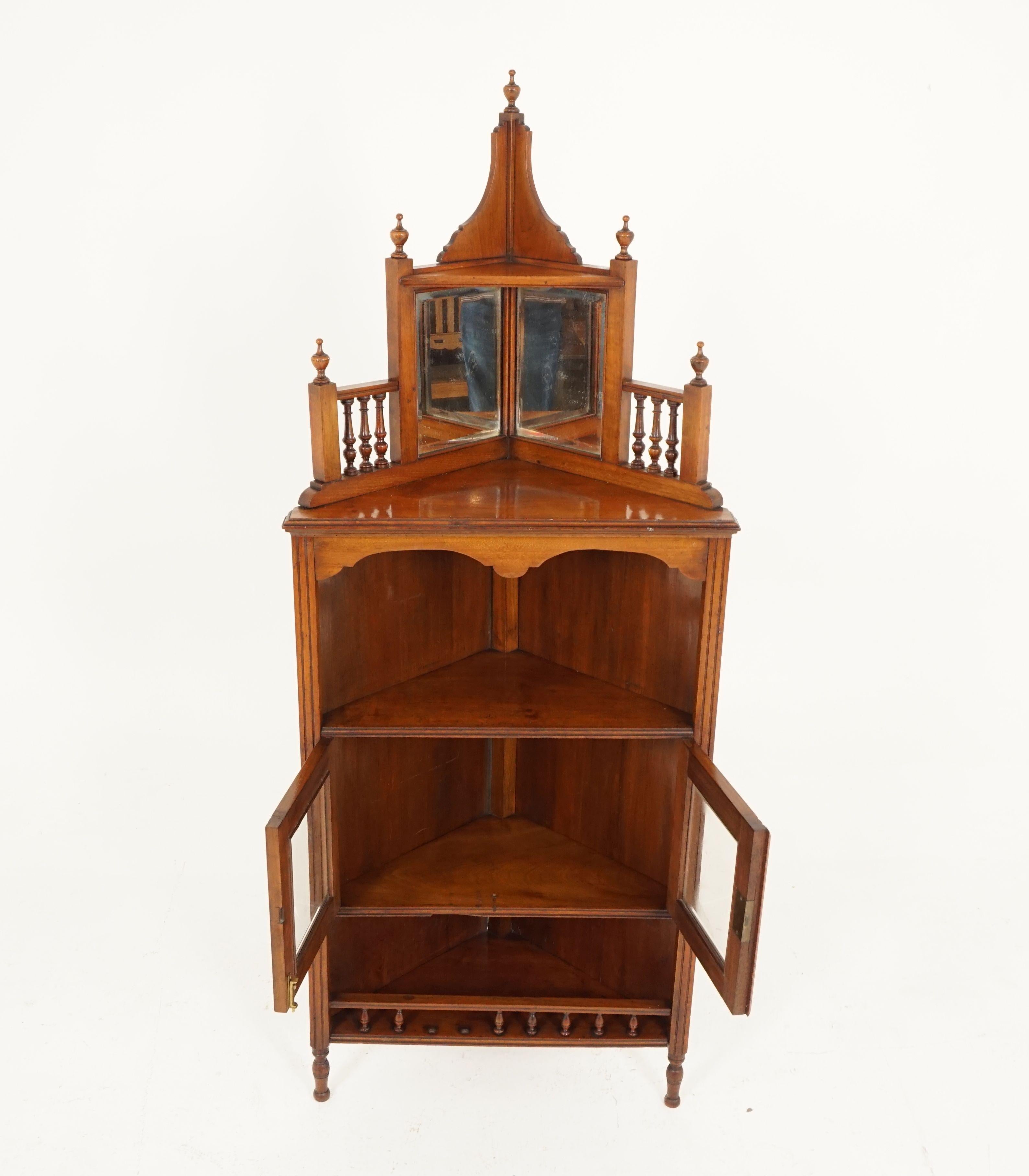 Antique Victorian standing corner cabinet, walnut, mirror back, Scotland 1880, H156

Scotland, 1880
Solid walnut
Original finish
Finial pediment to the top
Shelf below with finials on the ends
Pair of beveled mirrors with spindle ends and capped off