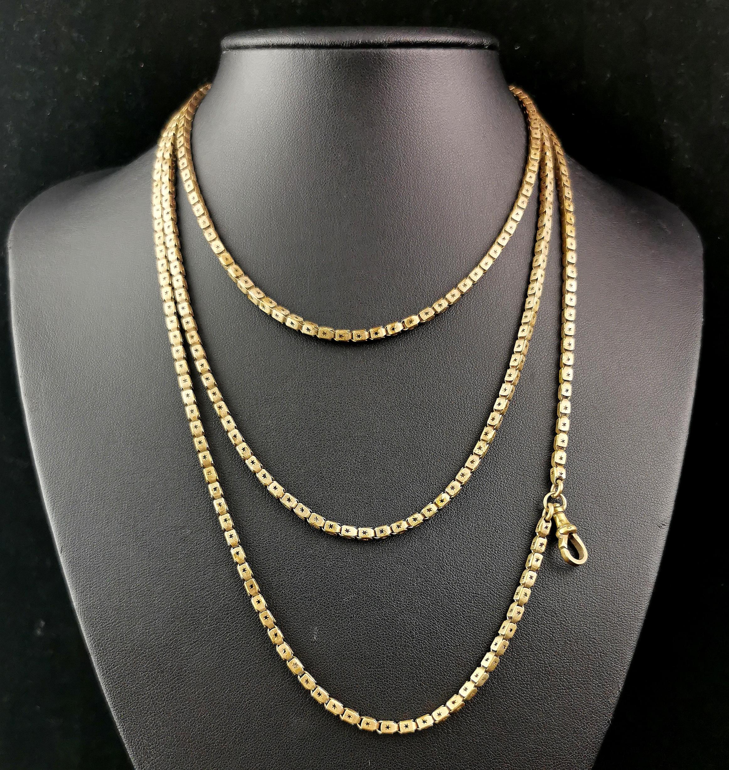 A gorgeous antique gilt brass fancy link chain necklace.

This chain has hollow box links each punched with a cut out star design giving it a fab celestial twist.

It has no fastener but it easily passes over the head with its lovely long length, it