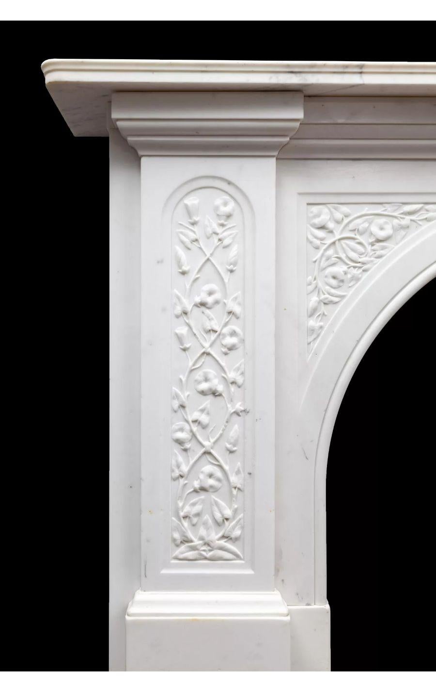 Antique Victorian Statuary Carrara Beautifully Carved Marble Mantel, circa 1880

A beautifully carved and proportioned, antique Victorian Statuary Carrara marble mantelpiece.

The D-top pilasters and arch panels carved with flowering nasturtium’s.