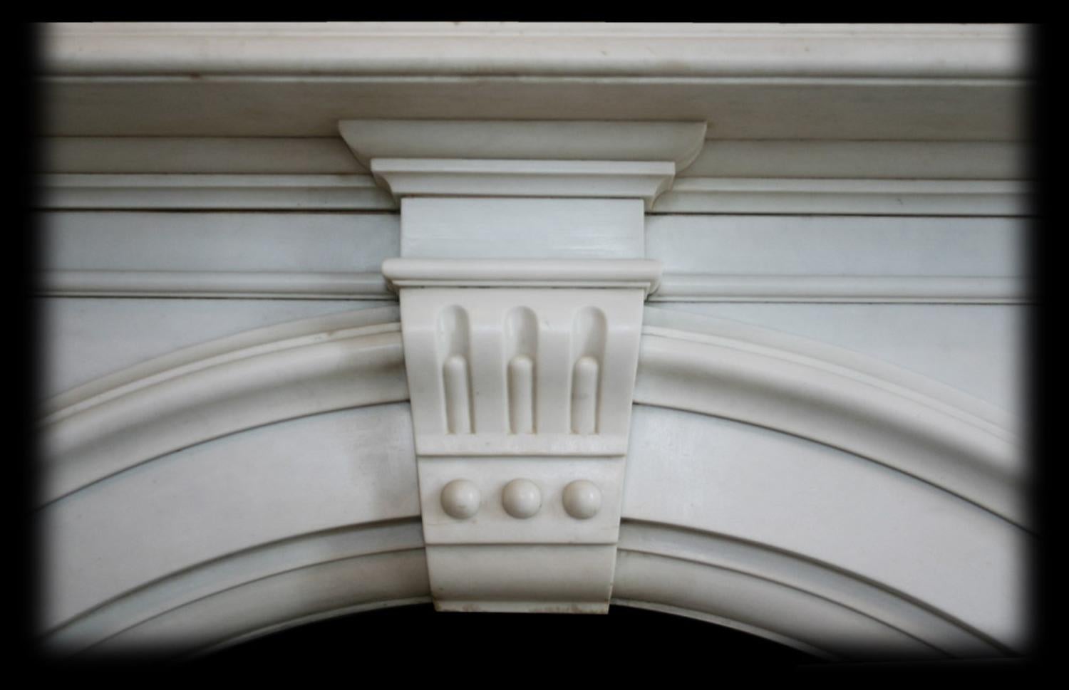 arched marble fireplace surround