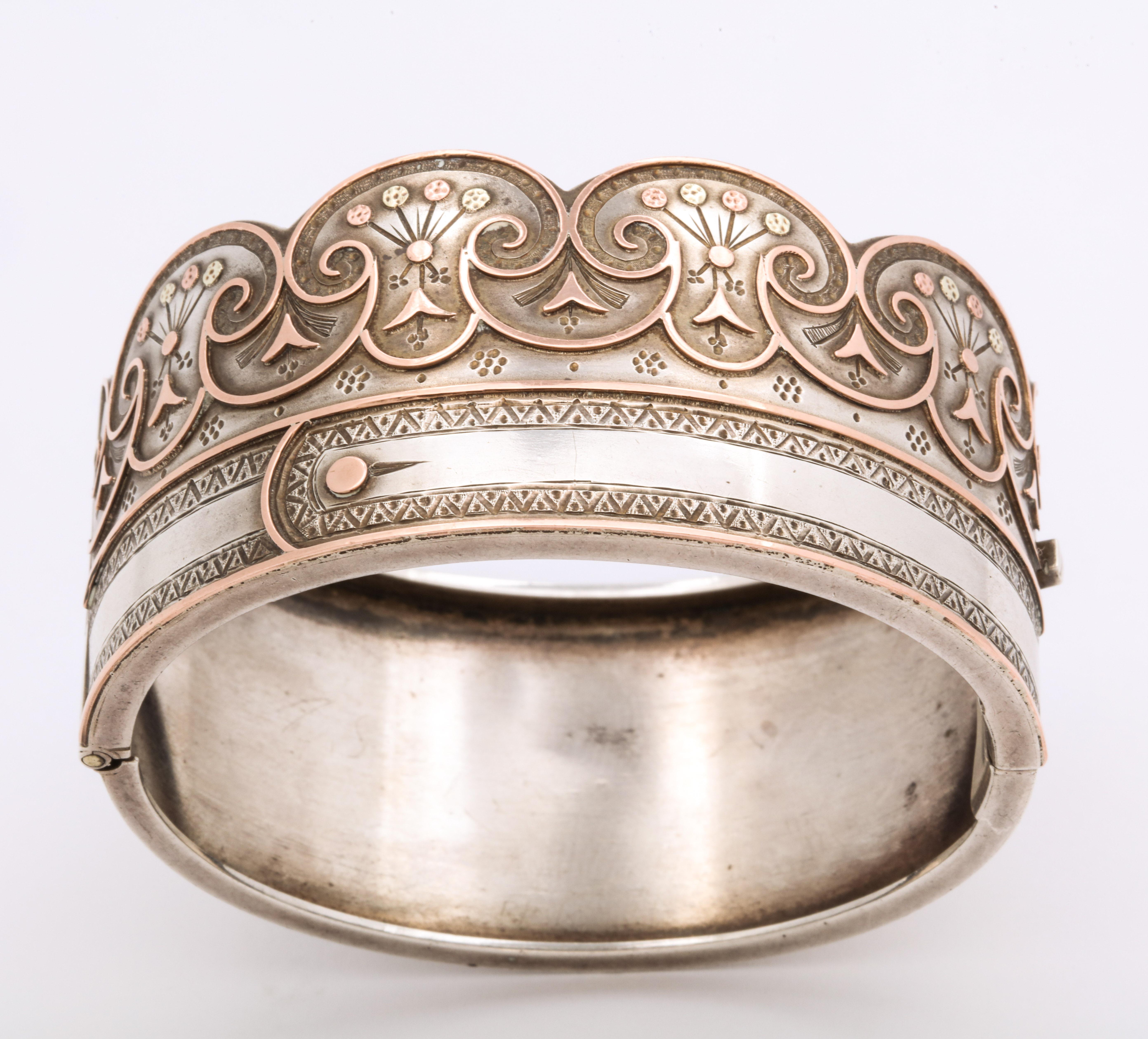  A curvaceous and unique Sterling and Gold Victorian Bracelet with the special meaning of the buttoned cuff that symbolizes joining two to become one e.g. as lovers, as husband and wife, in friendship or even two of the same mind. The scalloped