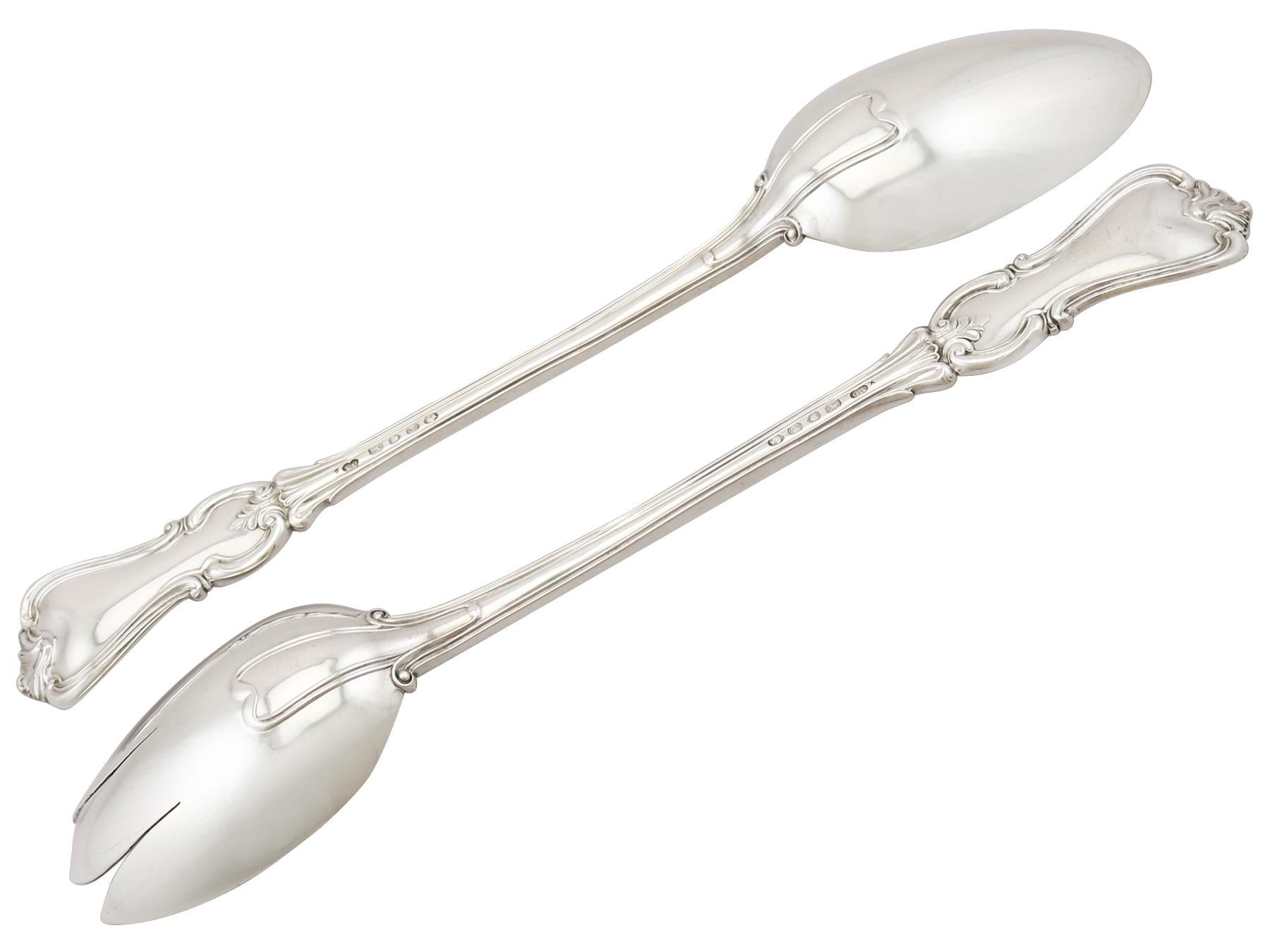An exceptional, fine and impressive pair of antique Victorian English sterling silver Albert pattern salad servers made by George William Adams; an addition to our silver flatware collection.

These exceptional antique Victorian sterling silver