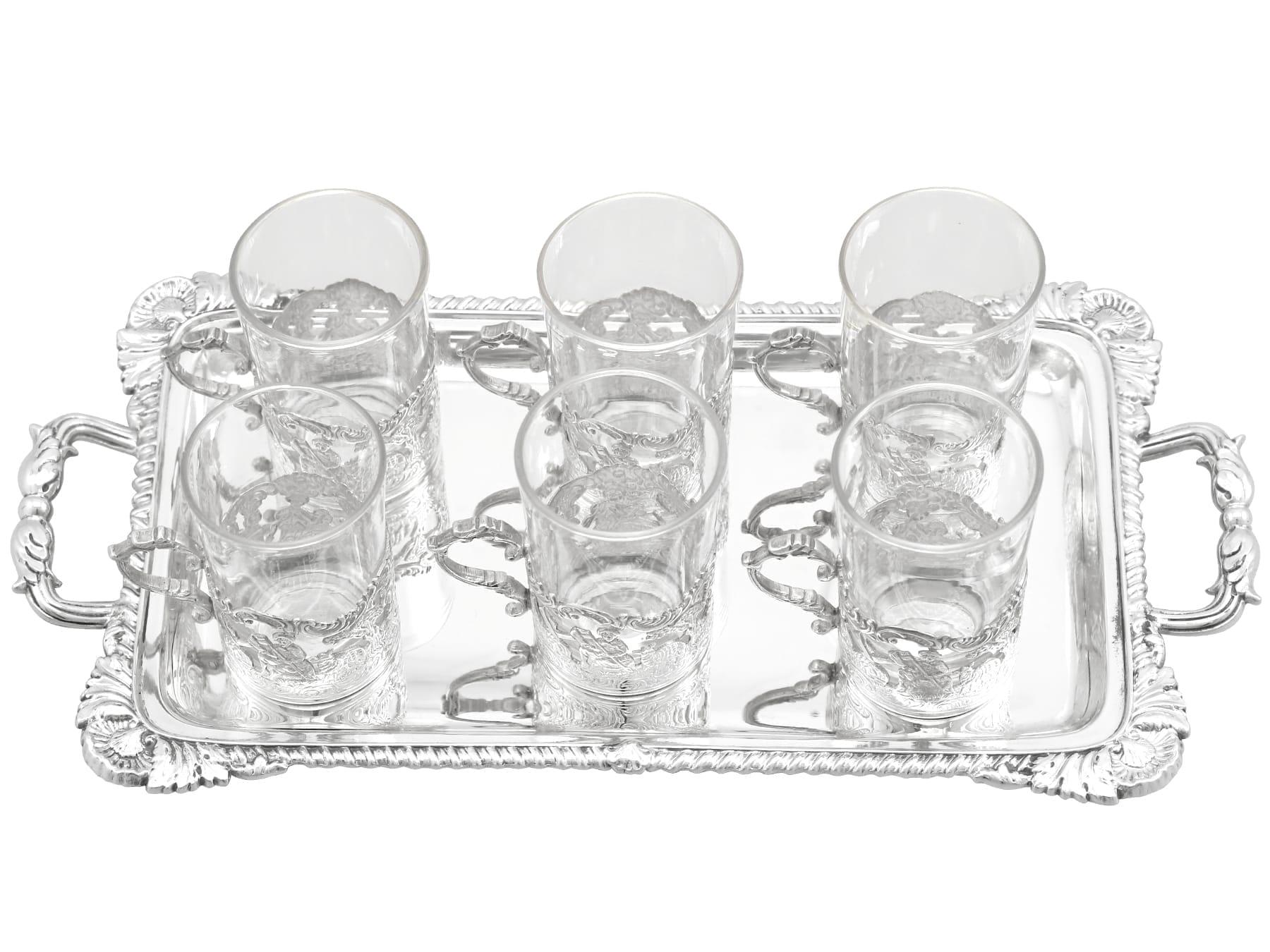 An exceptional, fine and impressive antique Victorian English sterling silver tray and silver mounted glass liqueur glasses - boxed; an addition to our Victorian silverware collection.

This exceptional, fine and impressive silver wine and drinks
