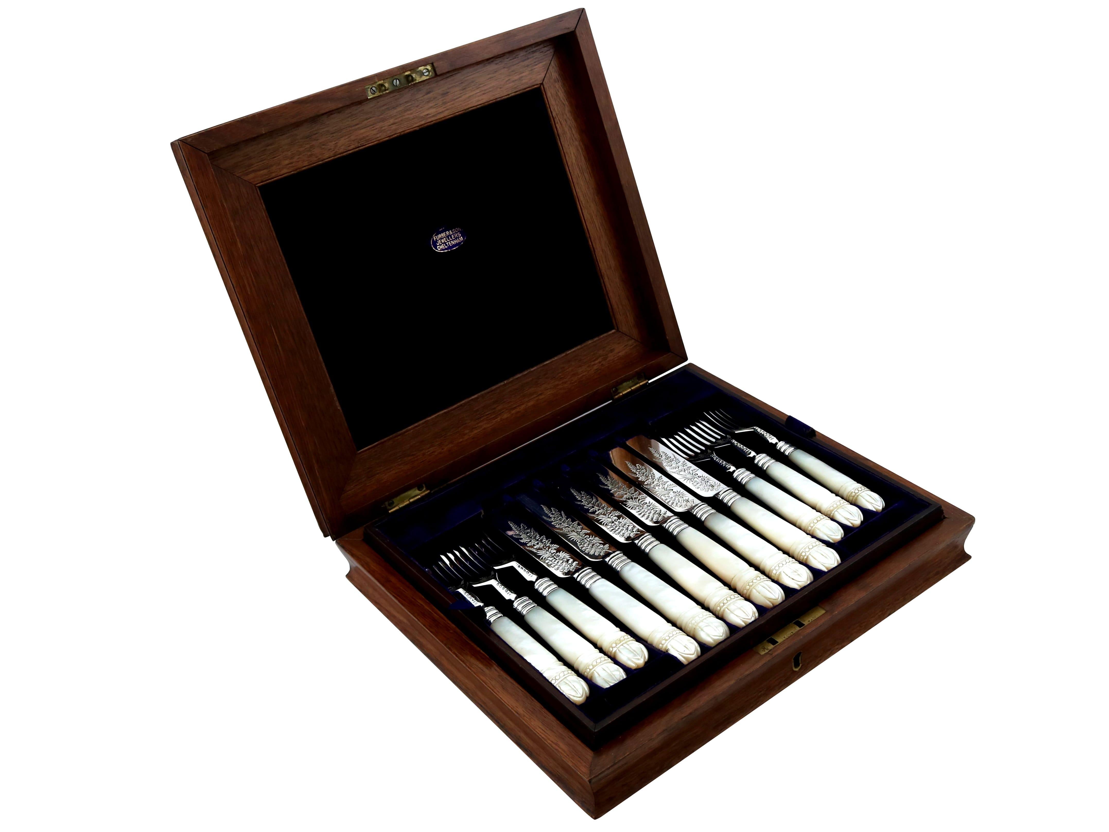 An exceptional, Fine and impressive antique Victorian English sterling silver and mother of pearl fruit/dessert cutlery set for twelve persons - boxed; an addition to our dining silverware collection

This exceptional antique dessert service, in