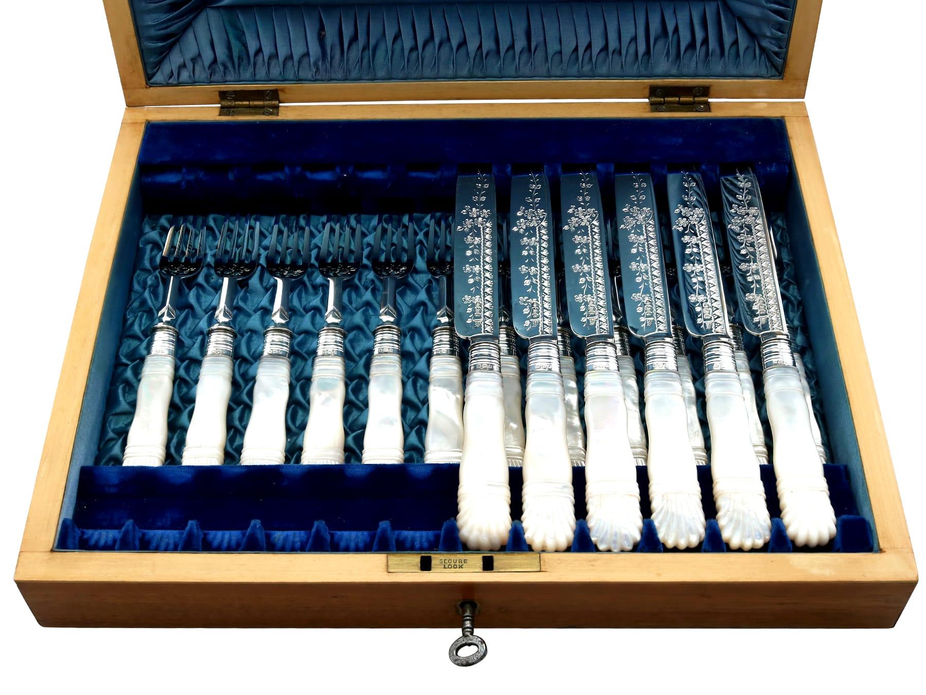An exceptional, fine and impressive antique Victorian English sterling silver and mother of pearl fruit/dessert cutlery set for twelve persons - boxed; an addition to our Victorian cutlery and flatware collections.

This exceptional, fine and