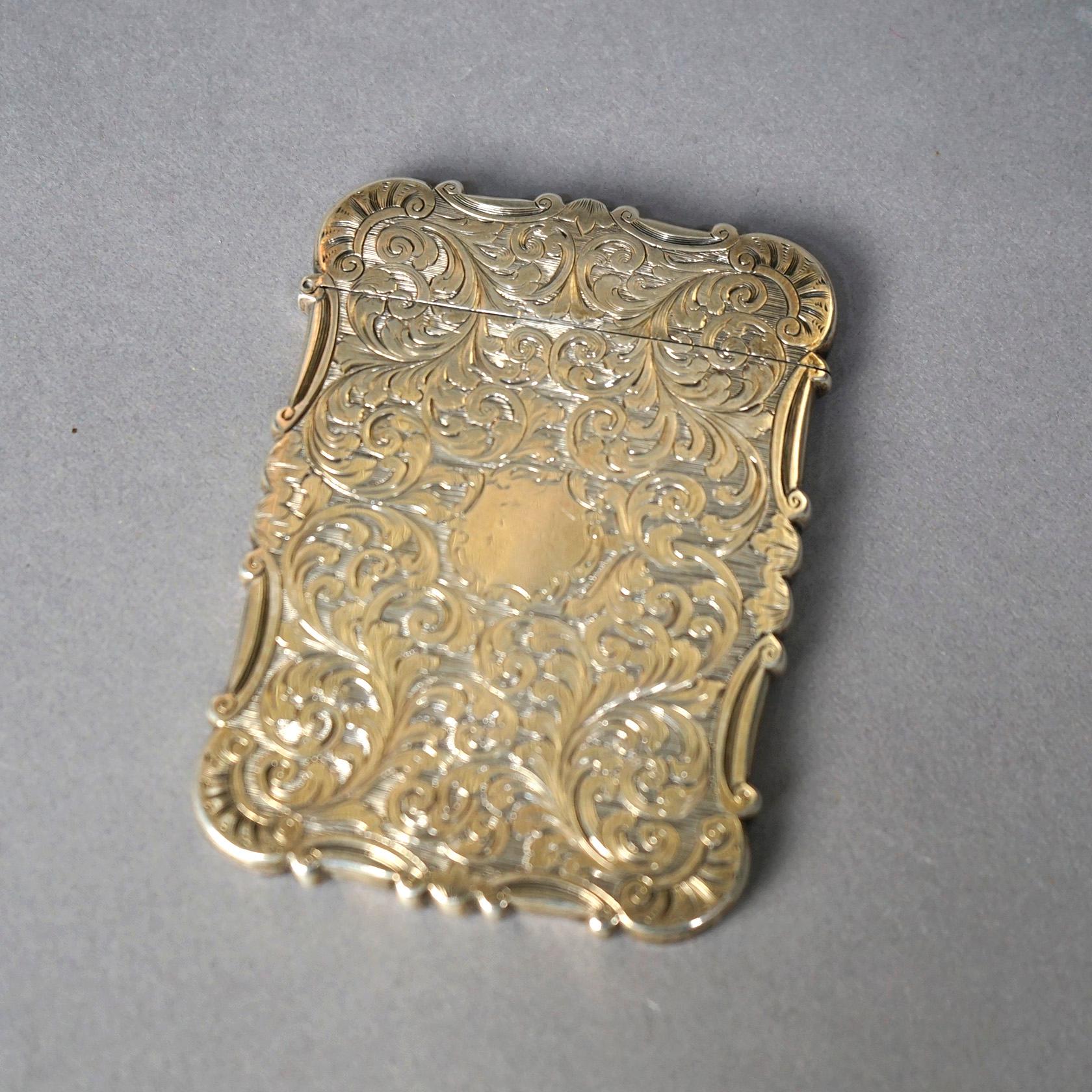 An antique Victorian calling card case offers sterling silver construction with foliate and scroll elements, c1890, 1,89 toz

Measures- 3.5''H x 2.5''W x .25''D.