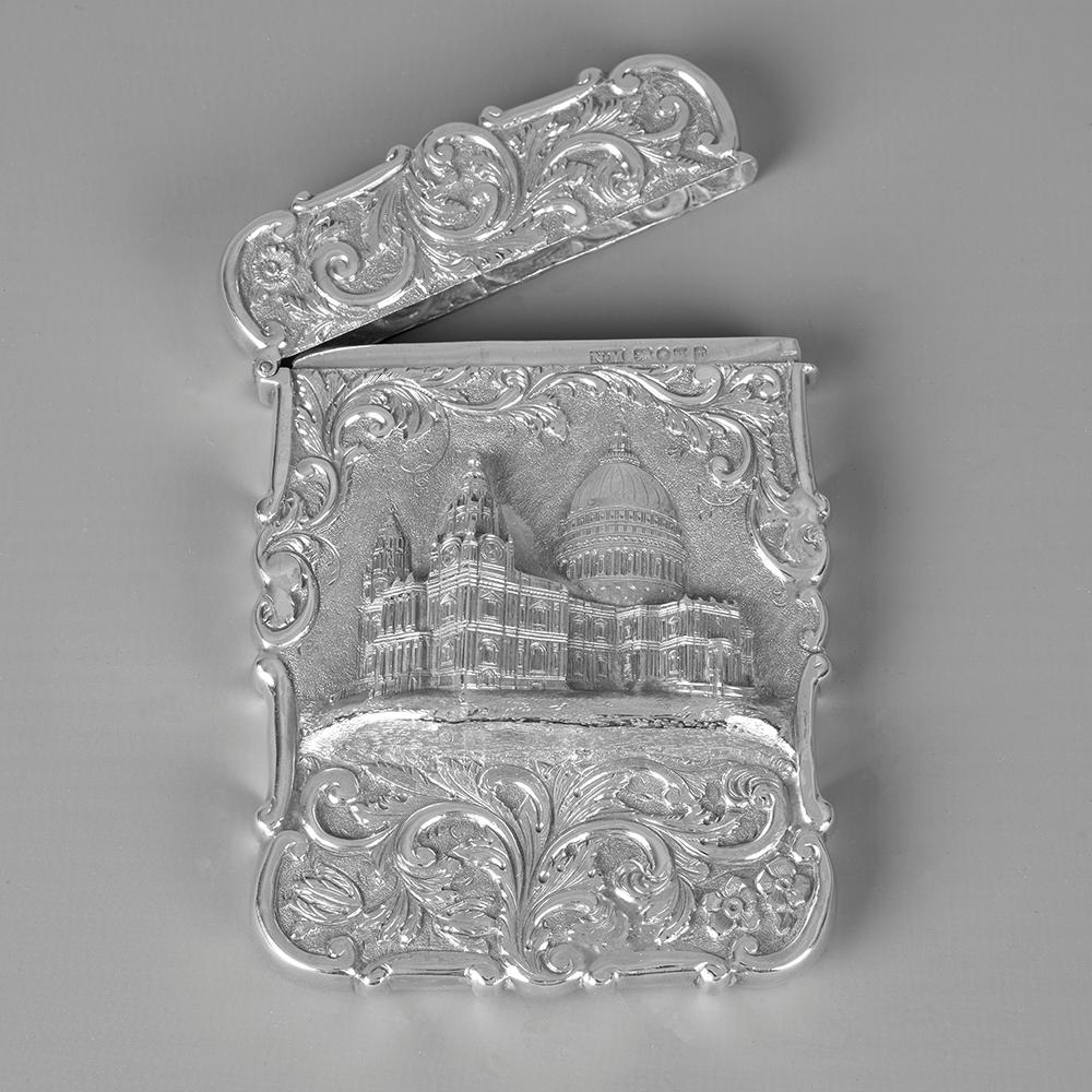 Nathaniel Mills castle-top card case, depicting St Paul’s Cathedral London, in high relief. The card case is shaped in a rectangular form with the view surrounded by scroll, flowerhead and foliate decoration on a matted ground. The reverse is