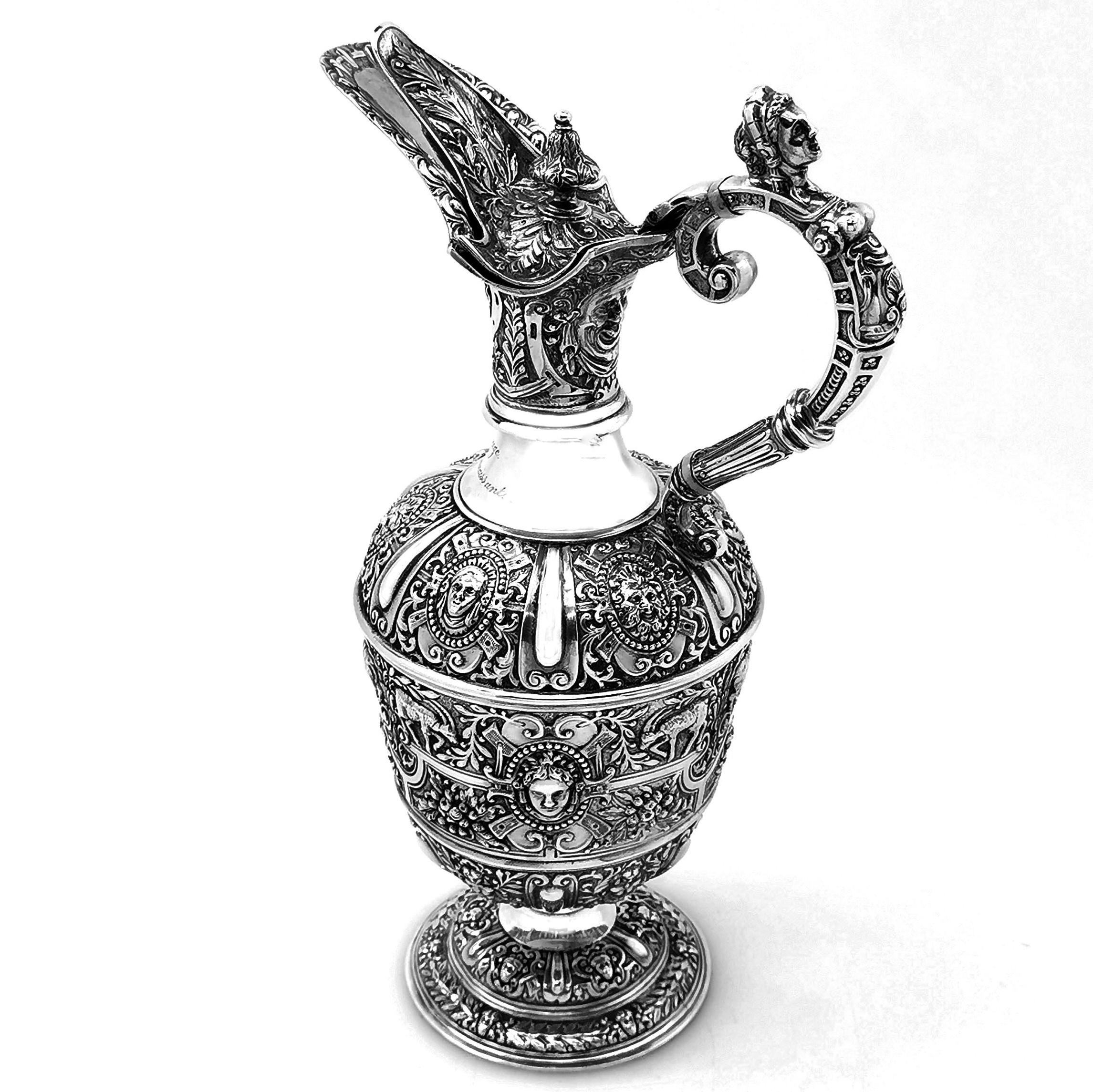 A beautiful Classic Antique Victorian solid Silver Jug in the traditional 'Cellini' design. The Jug features rich, detailed patterning and a figural handle and thumb piece. The Jug has a small engraving on the neck.

Made in London in 1889 by JN