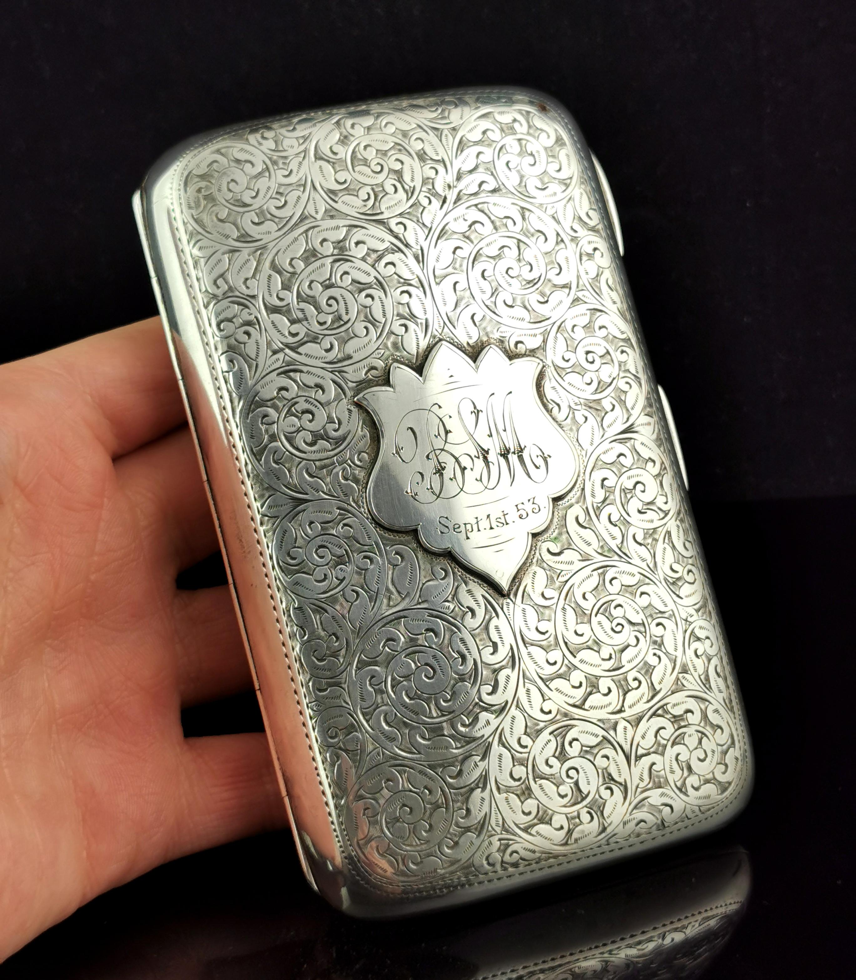 An attractive and decorative, antique sterling silver cigar case.

A lovely substantial and heavy piece, made from heavily engraved sterling silver, the case is gilt lined and still retains most of its rich gilt finish.

The engraving has a foliate