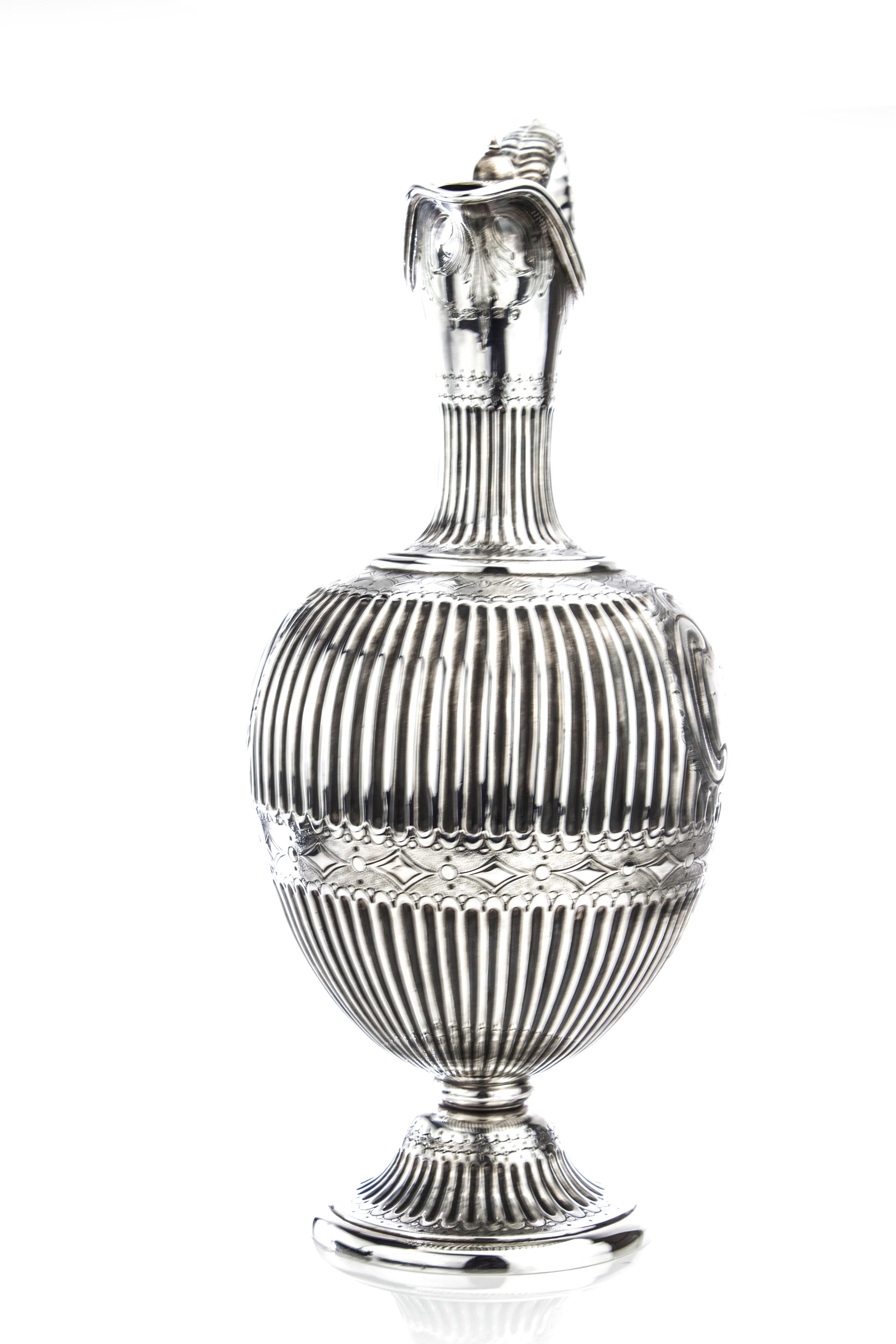Antique Victorian Sterling silver claret jug/ water pitcher
Made in England, London, 1861
Maker: Martin, Hall & Co (Richard Martin & Ebenezer Hall)
Fully hallmarked.

Dimensions:
Height 31.5 cm, width 16 cm, diameter 13 cm
Approximate weight