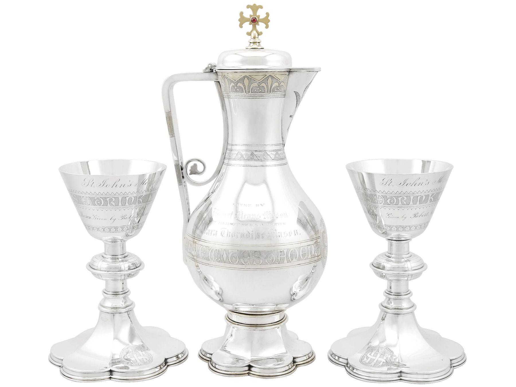 An exceptional, fine and impressive antique English sterling silver communion set; an addition to our diverse religious silverware collection.

This exceptional antique Victorian sterling silver communion set consists of a flagon, a large