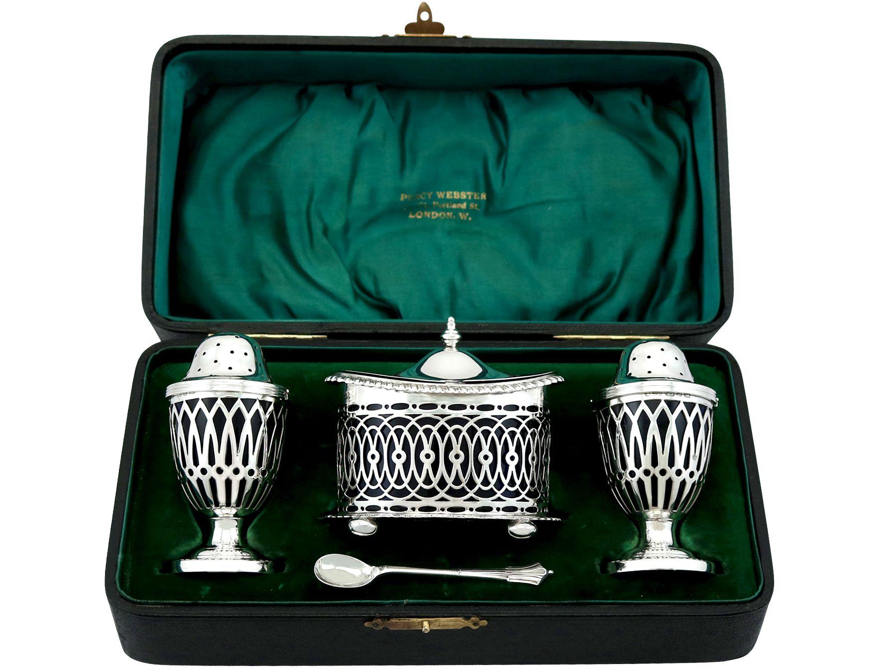 An exceptional, fine and impressive antique Victorian English sterling silver three piece condiment/cruet set - boxed; an addition to our dining silverware collection.

This exceptional antique Victorian English sterling silver condiment set