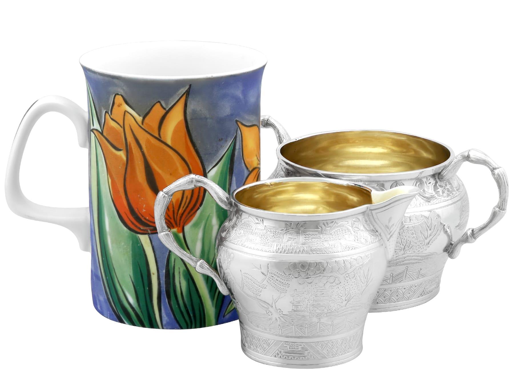 An exceptional, fine and impressive antique Victorian English sterling silver cream jug and sugar bowl; an addition to our silver teaware collection.

This exceptional antique Victorian English sterling silver cream jug and sugar bowl have a