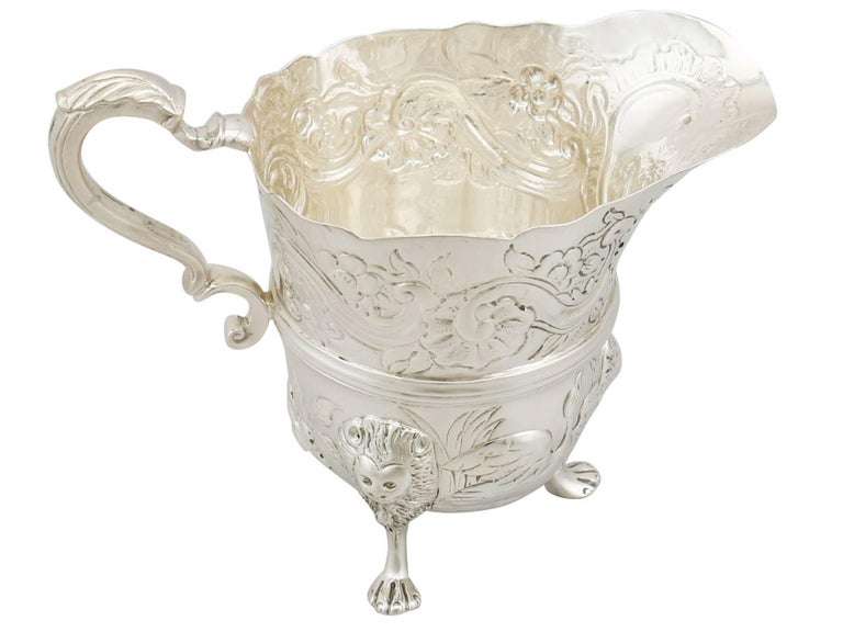 An exceptional, fine and impressive antique Victorian English sterling silver cream jug; an addition to our silver teaware collection.

This fine antique Victorian sterling silver cream jug has a plain circular inverted bell shaped form, in the