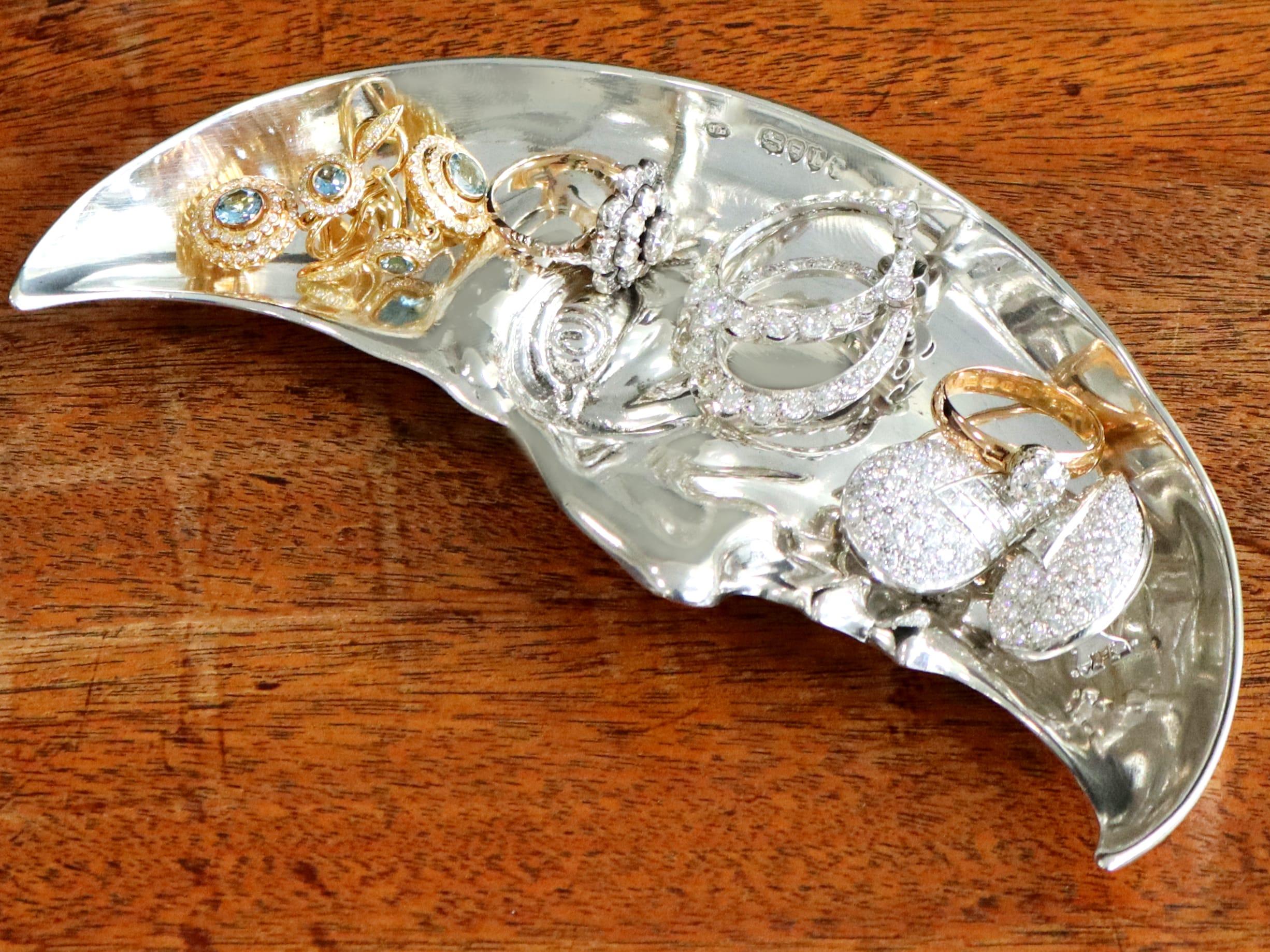 An exceptional, fine and impressive antique Victorian English sterling silver crescent moon dish/trinket tray; an addition to our diverse ornamental silverware collection

This exceptional and rare antique Victorian cast sterling silver trinket tray