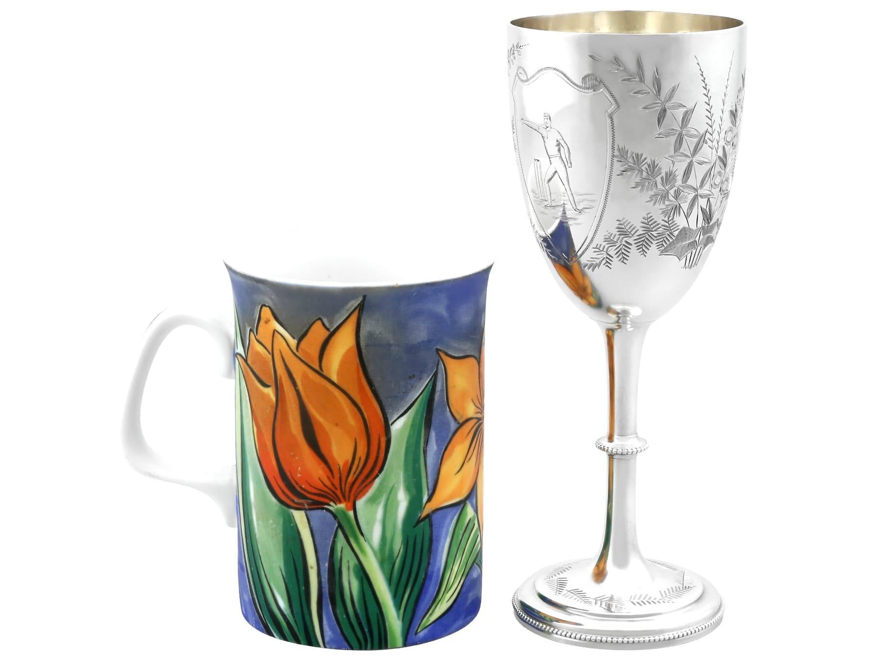 An exceptional, fine and impressive antique Victorian English sterling silver presentation goblet and tie pin set with cricket influence; an addition to our collection of silver drinkware.

This exceptional antique sterling silver goblet has a