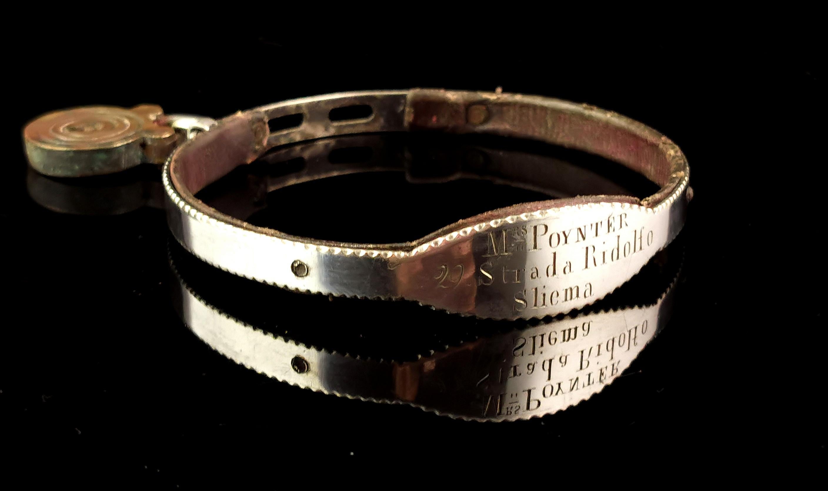 A beautiful antique silver and leather dog collar.

A prized possession for a beloved pet, this collar has a band of silver mounted onto a leather collar, the front engraved with; Mrs Poynter, 22 Strada Ridolfo, Sliema.

This is an address in Malta