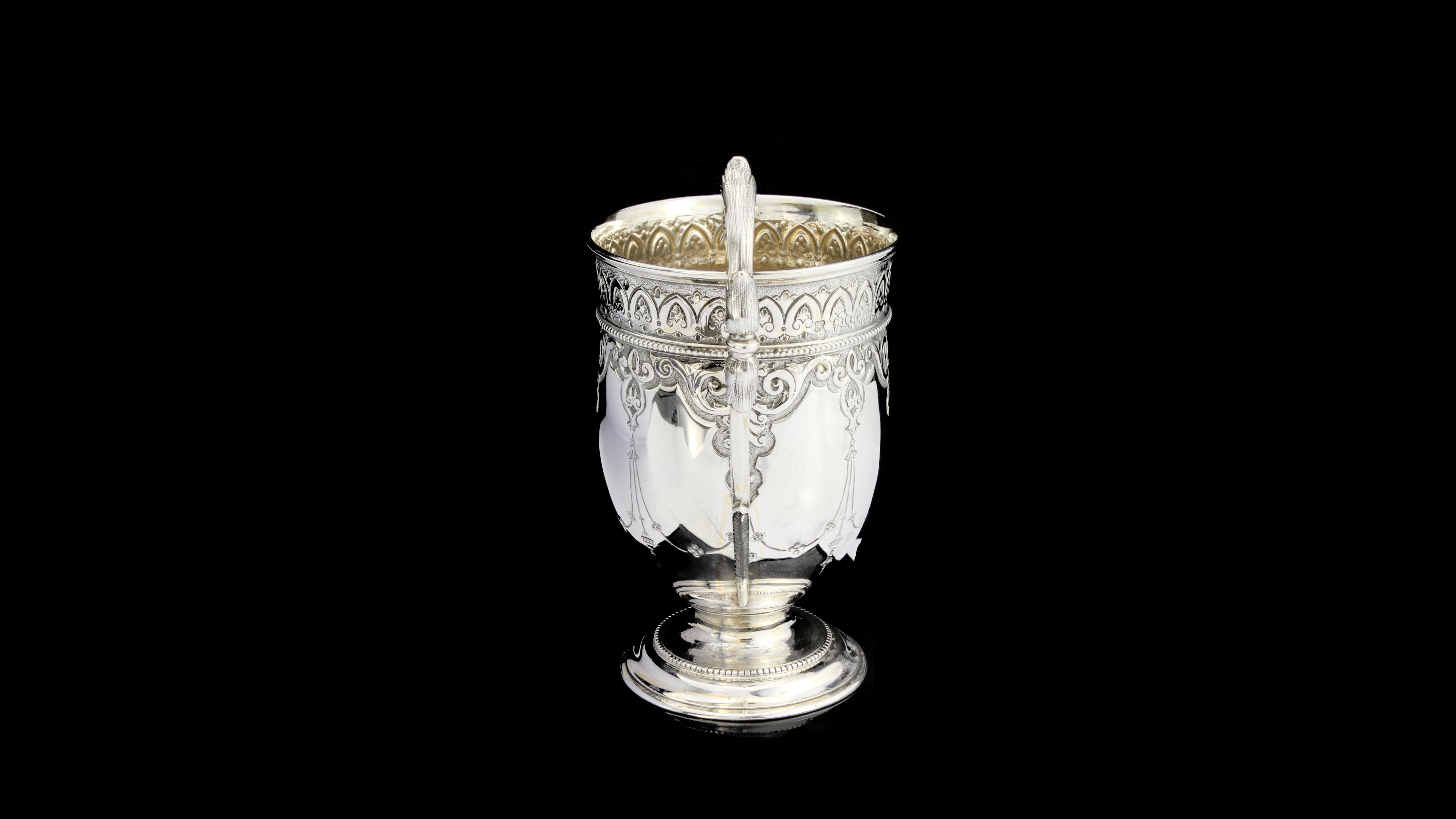 Antique Victorian sterling silver drinking cup 
Maker: Martin, Hall & Co (Richard Martin & Ebenezer Hall)
Made in England, London, 1872
Fully hallmarked.

The firm Martin Hall was established as a partnership in 1820 in Sheffield by Henry