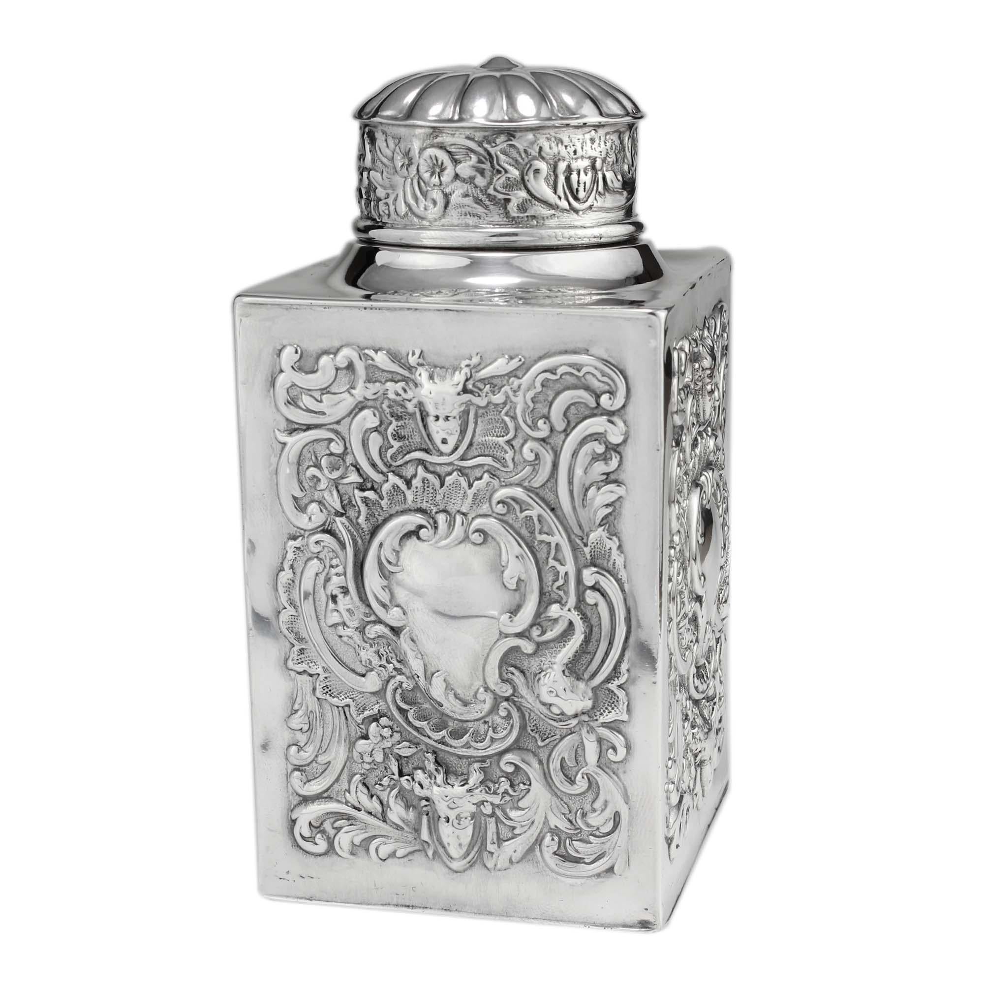 Antique Victorian sterling silver embossed tea caddy decorated with scrolls and vacant cartouches.

Tea caddy has a pull of lid, the box is decorated with embossed scrolls and vacant cartouches from all sides.

Maker: William Comyns & Sons
Made