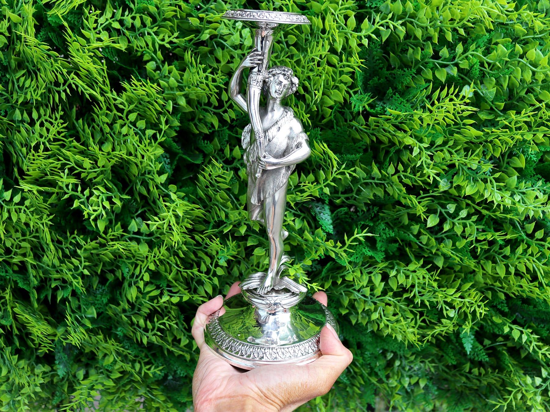 An exceptional, fine and impressive, pair of antique Victorian English cast sterling silver figural candlesticks; an addition of our ornamental silverware collection.

These exceptional, fine and impressive antique Victorian English cast sterling