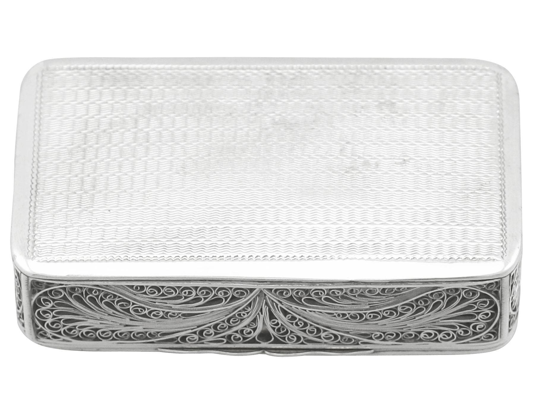 An exceptional, fine and impressive unusual antique Victorian English sterling silver filigree box; an addition to our ornamental silverware collection.

This exceptional antique Victorian sterling silver box has a rectangular form with rounded