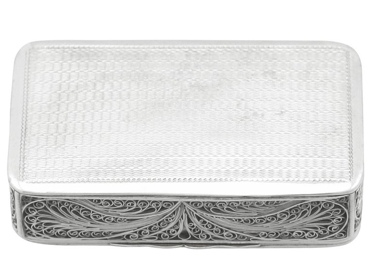 An exceptional, fine and impressive unusual antique Victorian English sterling silver filigree box; an addition to our ornamental silverware collection.

This exceptional antique Victorian sterling silver box has a rectangular form with rounded