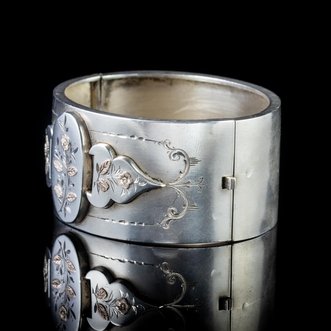 A fabulous antique Victorian bangle showcasing a stunning front gallery with a decorative engraved border and three detailed 18ct Rose Gold Forget me nots.

Forget me nots in an old German tale were discovered by two lovers walking by a river one