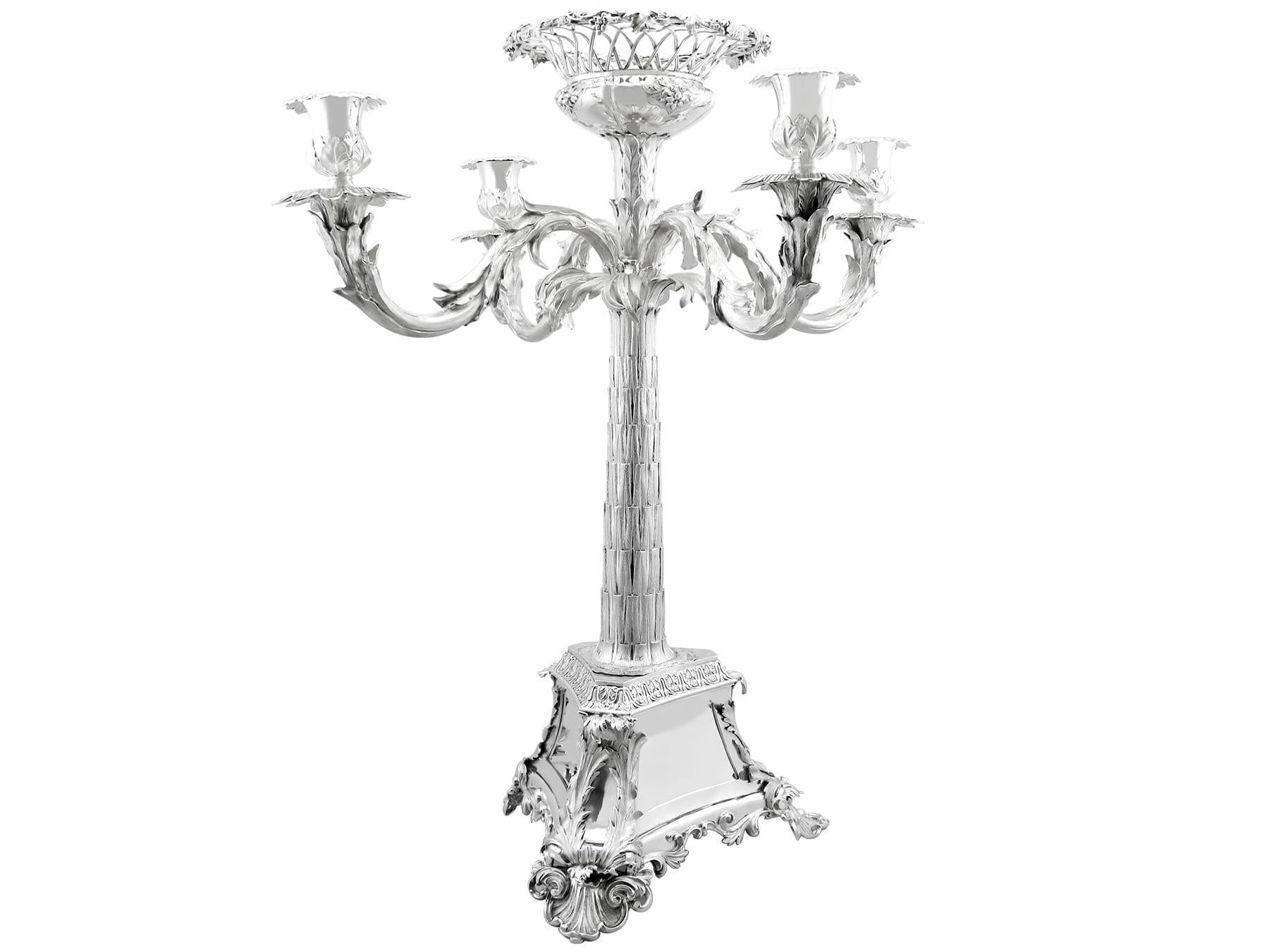 A magnificent, fine and impressive, large antique Victorian English sterling silver four light candelabrum centrepiece; an addition to our ornamental silverware collection.

This magnificent antique English sterling silver four light candelabrum has