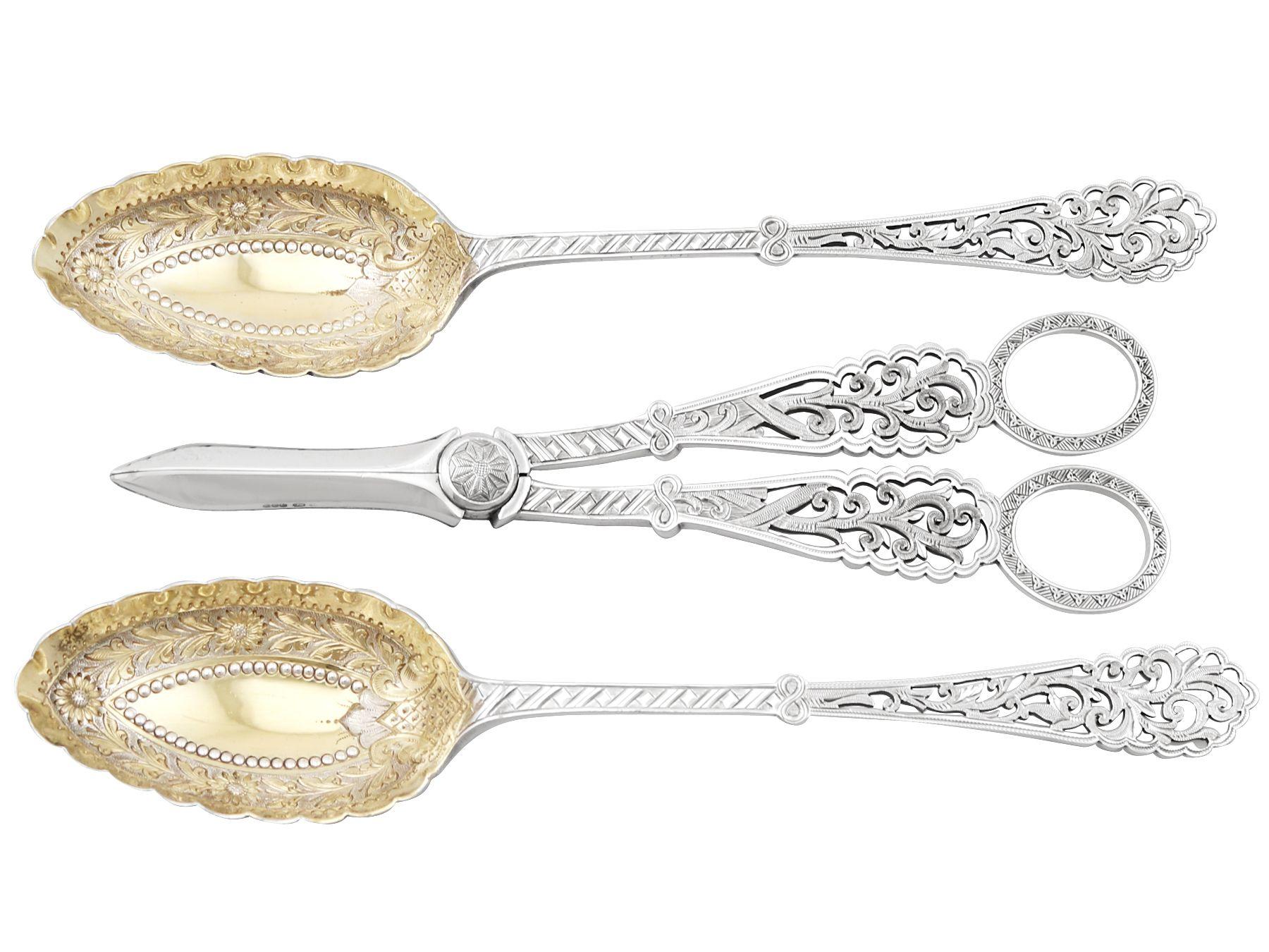 An exceptional, fine and impressive antique Victorian English sterling silver fruit serving set, boxed, an addition to our dining silverware collection.

This exceptional antique Victorian sterling silver fruit serving set consists of a pair of