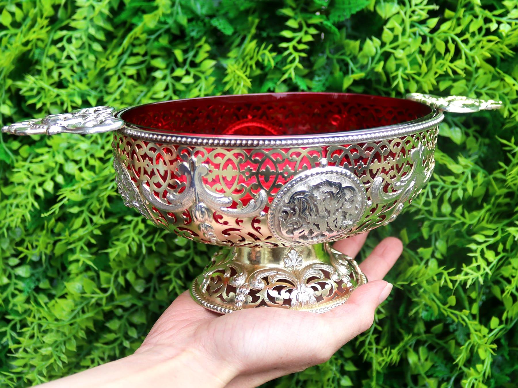 An exceptional, fine and impressive antique Victorian English sterling silver gilt and cranberry glass dish; an addition to our ornamental silverware collection

This exceptional antique Victorian sterling silver dish has an oval form.

The sterling