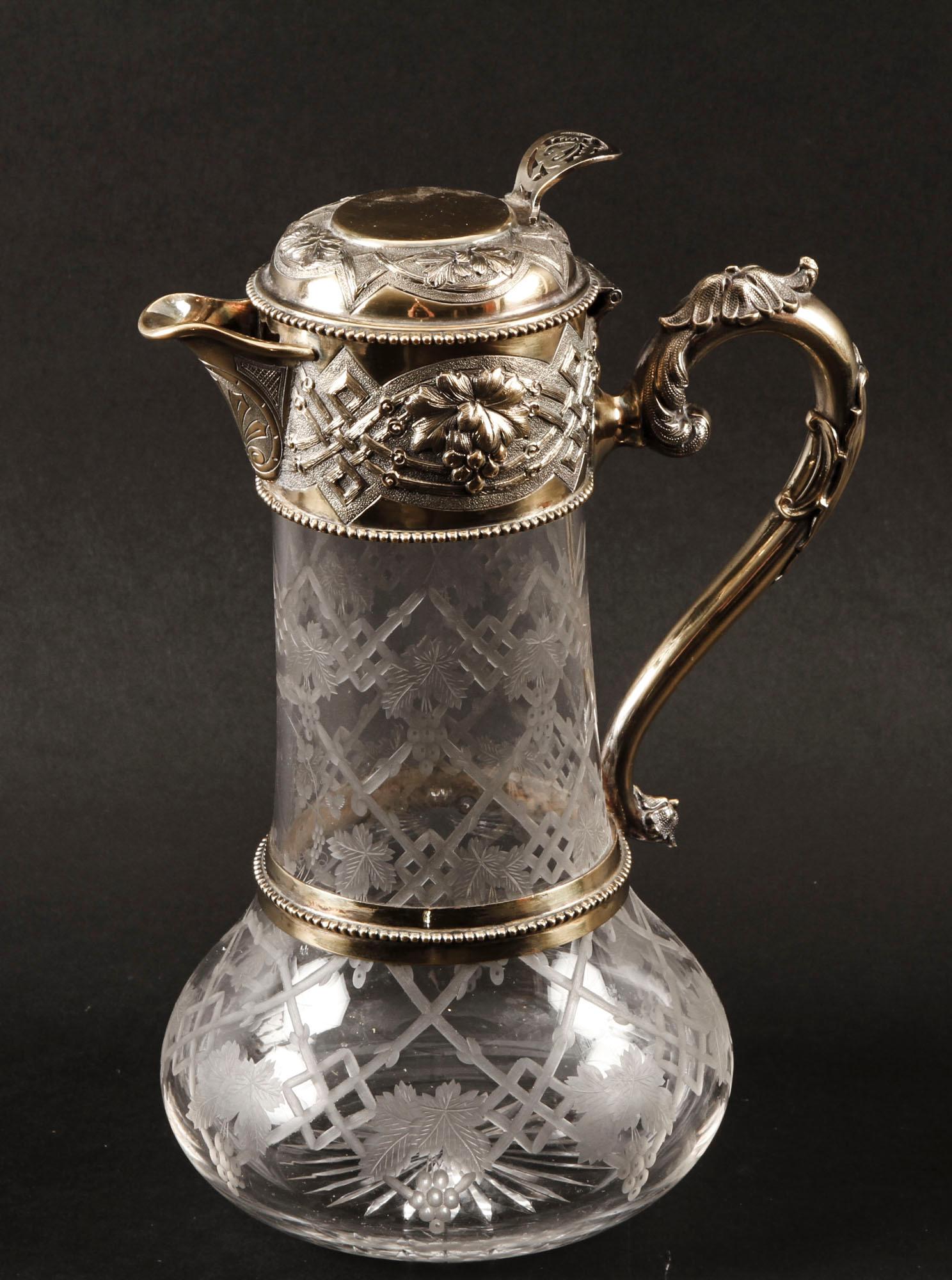 This is a wonderful antique Victorian sterling silver-gilt mounted claret jug, with makers mark for W&G Sissons and hallmarks for Sheffield 1873.

The silver-gilt mounted claret jug, beautifully chased and etched with strapwork and fruiting vine,