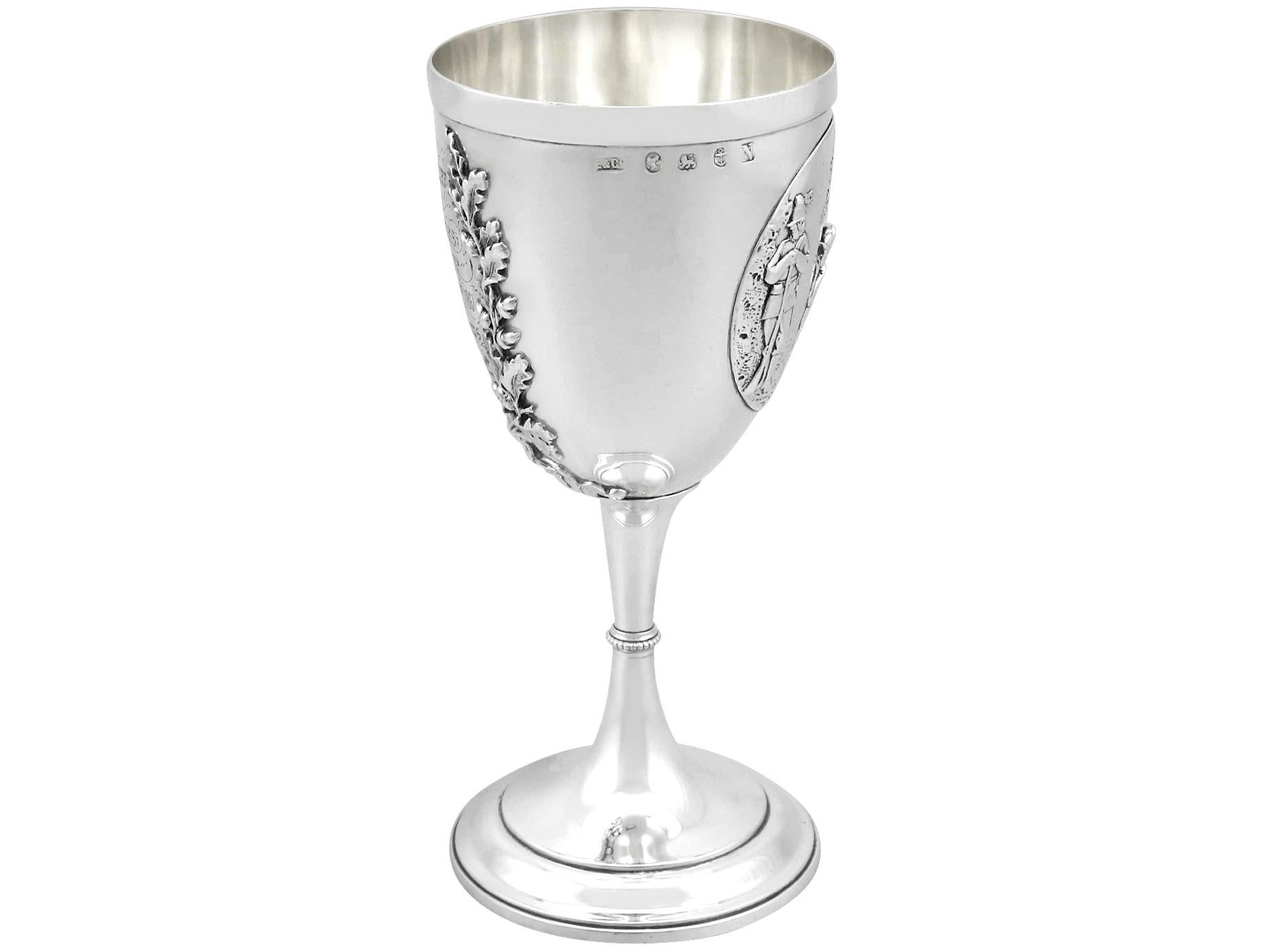 An exceptional, fine and impressive antique Victorian English sterling silver goblet; an addition to our collection of wine and drinks related silverware.

This exceptional antique sterling silver goblet has a circular bell-shaped form onto a