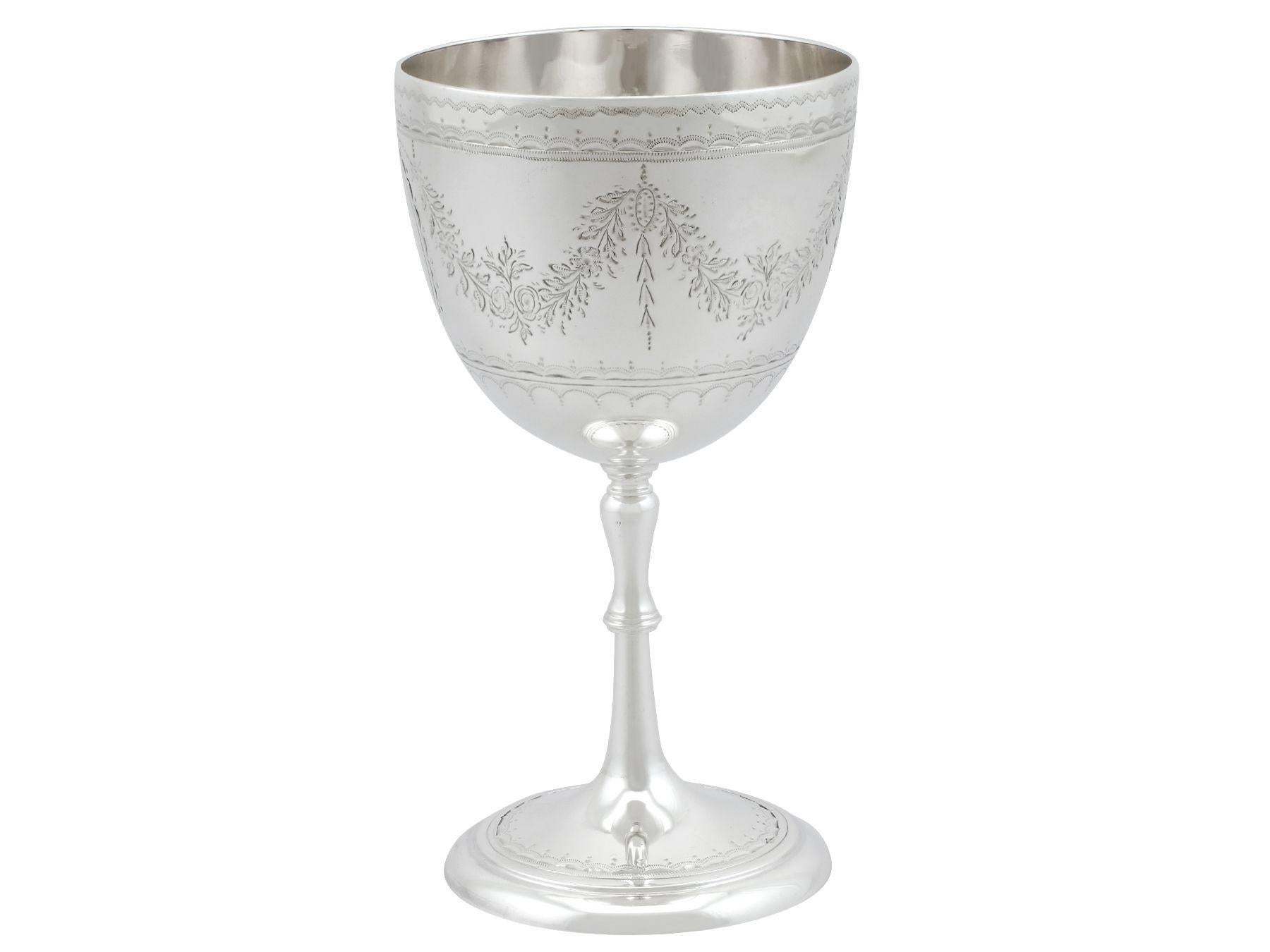 An exceptional, fine and impressive antique Victorian English sterling silver goblet; an addition to our collection of wine and drinks related silverware.

This exceptional antique Victorian sterling silver goblet has a circular bell shaped form