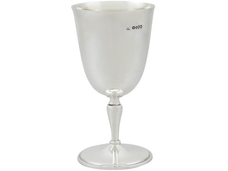 An exceptional, fine and impressive antique Victorian English sterling silver goblet, an addition to our wine and drinks related silverware collection.

This exceptional antique Victorian sterling silver goblet has a plain bell shaped form onto a