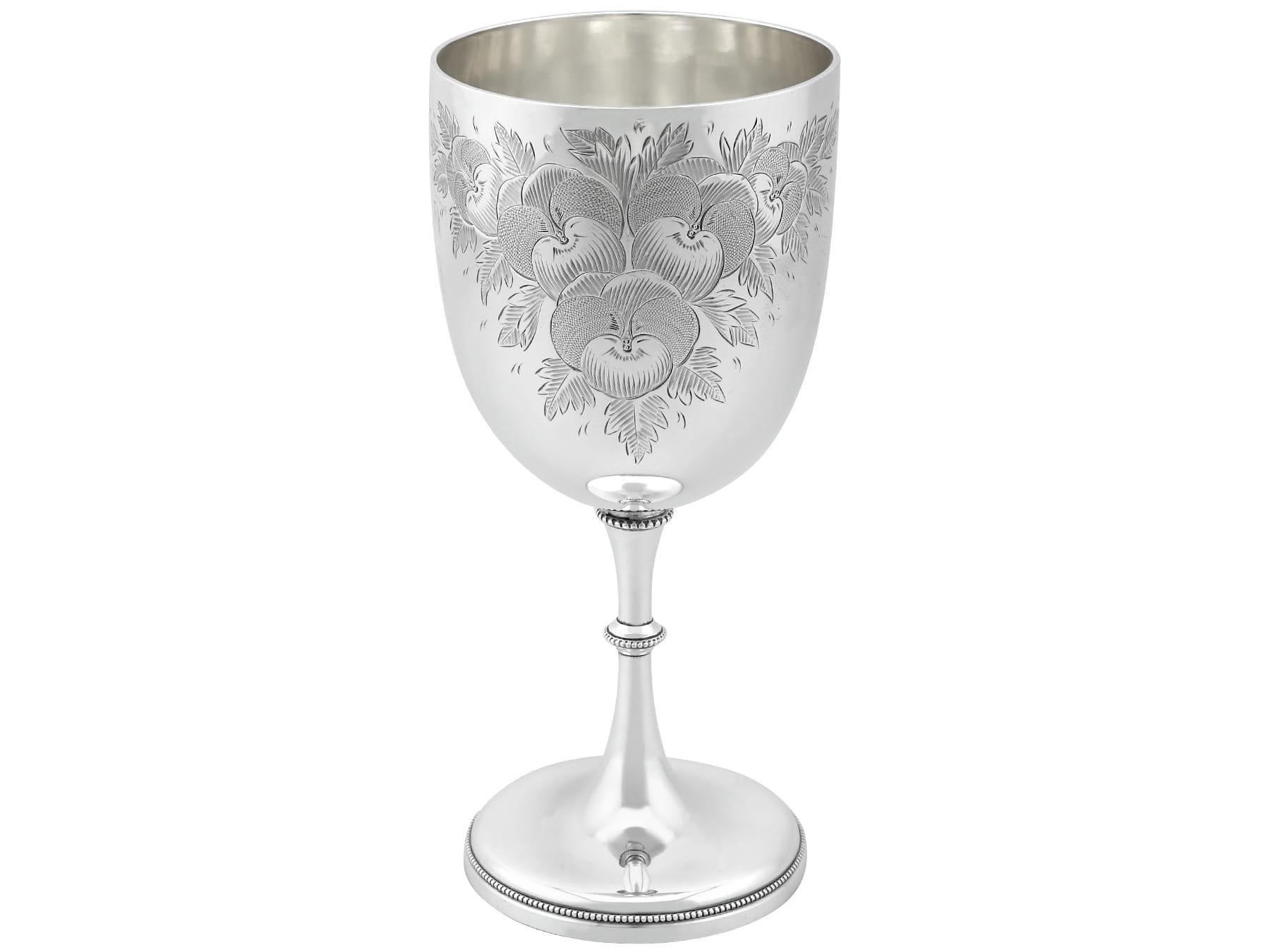 An exceptional, fine and impressive, unusual antique Victorian English sterling silver goblet; an addition to our collection of presentation related silverware.

This exceptional antique Exeter sterling silver goblet has a circular bell-shaped