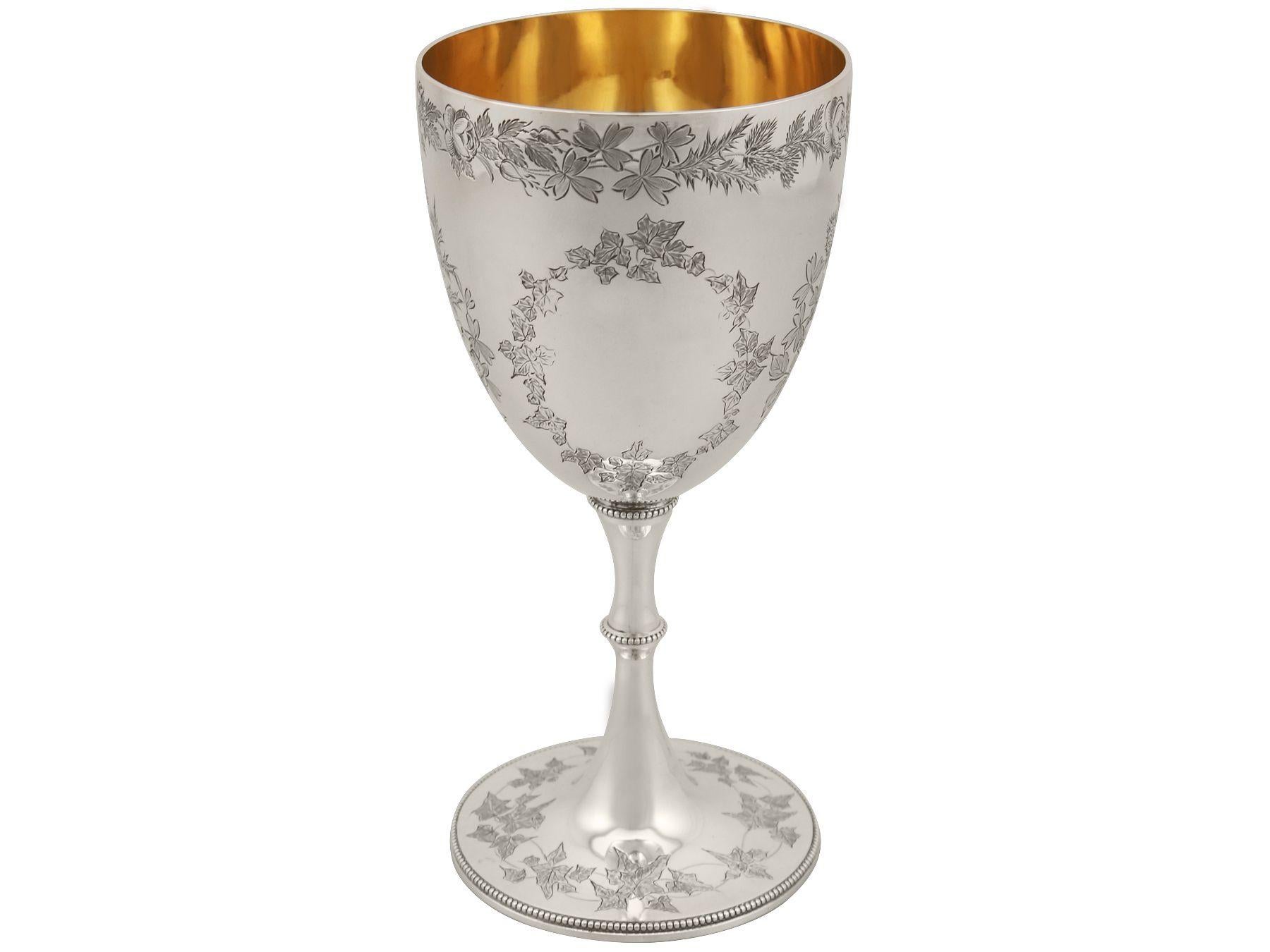 An exceptional, fine and impressive antique Victorian English sterling silver goblet made by George Adams - boxed; an addition to our collection of wine and drinks related silverware.

This exceptional antique Victorian sterling silver goblet has a