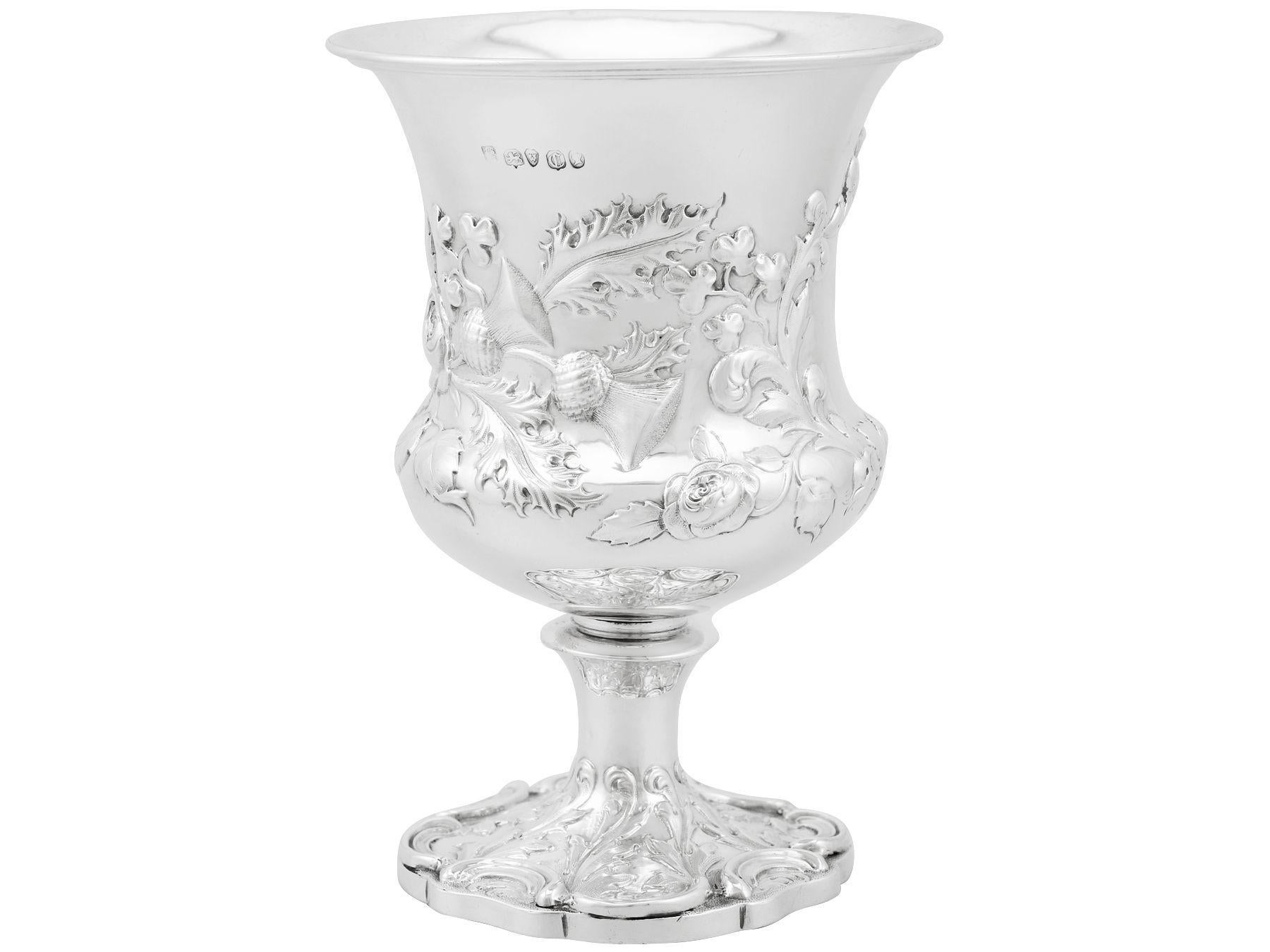 An exceptional, fine and impressive antique Victorian English sterling silver goblet; an addition to our collection of wine and drinks related silverware.

This exceptional antique Victorian sterling silver goblet has a circular Campania shaped