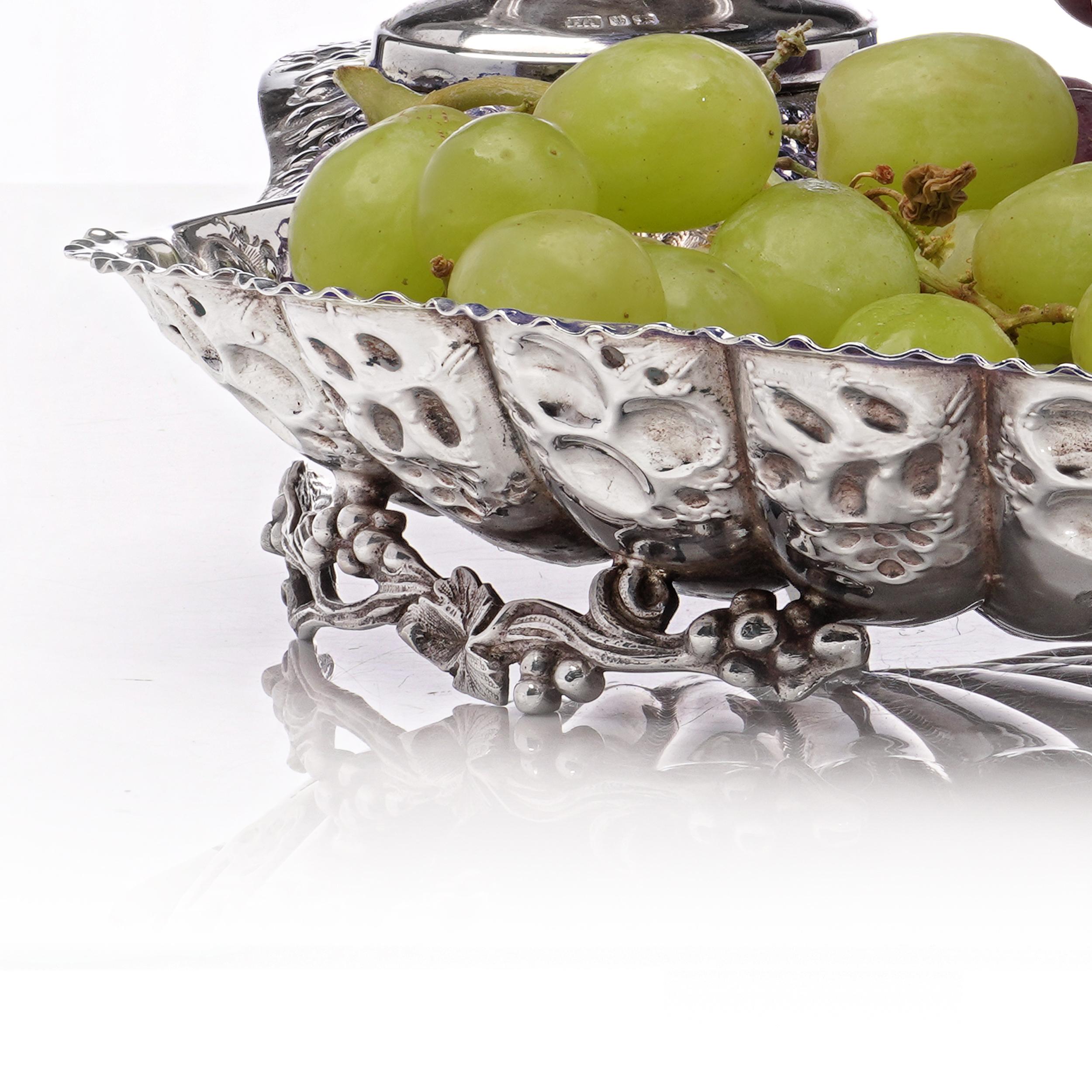 Antique Victorian Sterling Silver Grape Dish with Grape Scissors
Henry Atkins, Sheffield, 1893

An exquisite Victorian sterling silver grape dish, masterfully crafted in 1893 by Henry Atkins, Sheffield. Shaped as a scalloped shell, the dish is