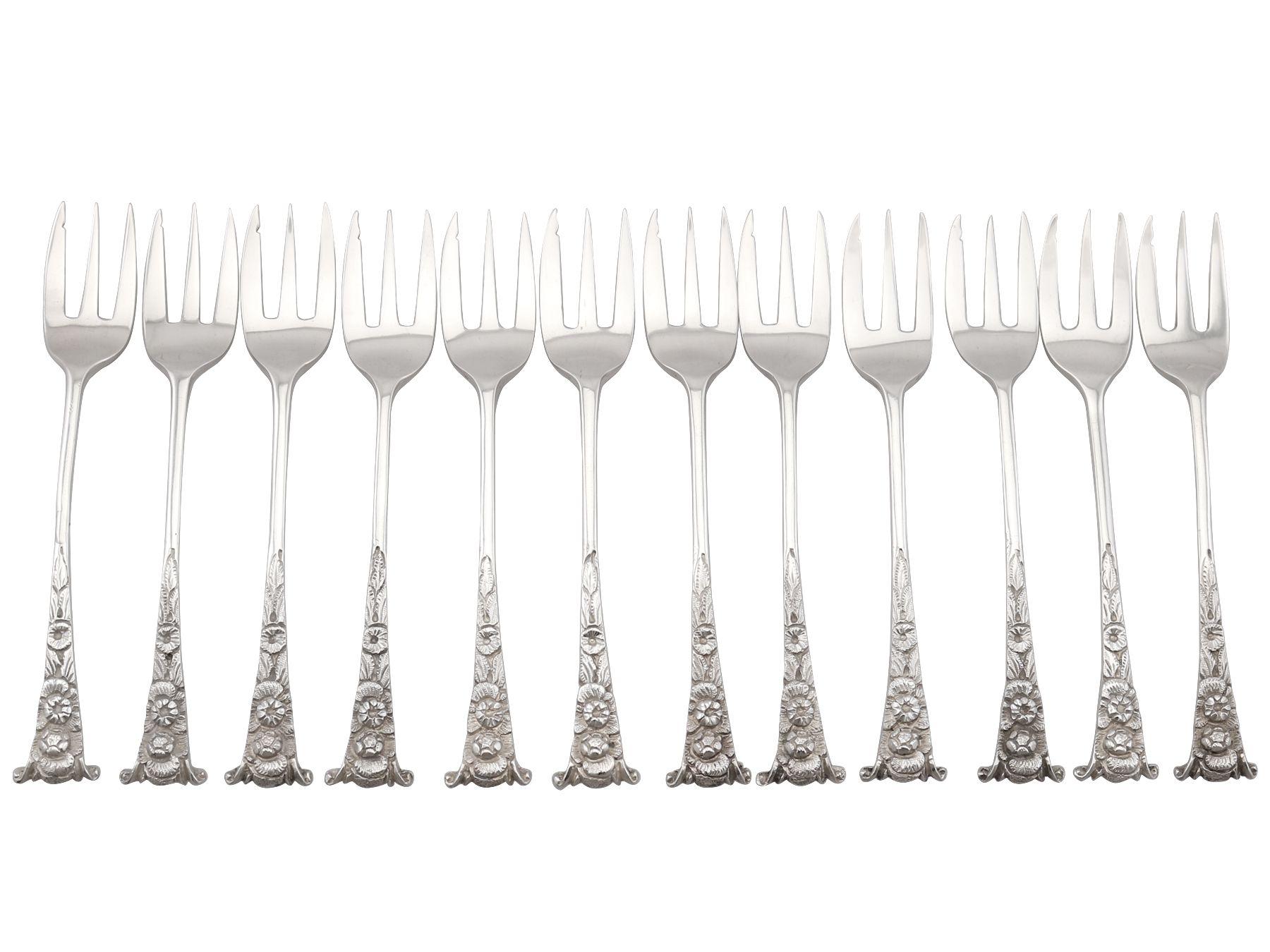 An exceptional, fine and impressive antique Victorian English sterling silver hors d'oeuvre fork set for twelve persons - boxed; an addition to our silver flatware collection.

These exceptional antique Victorian sterling silver hors d'oeuvre